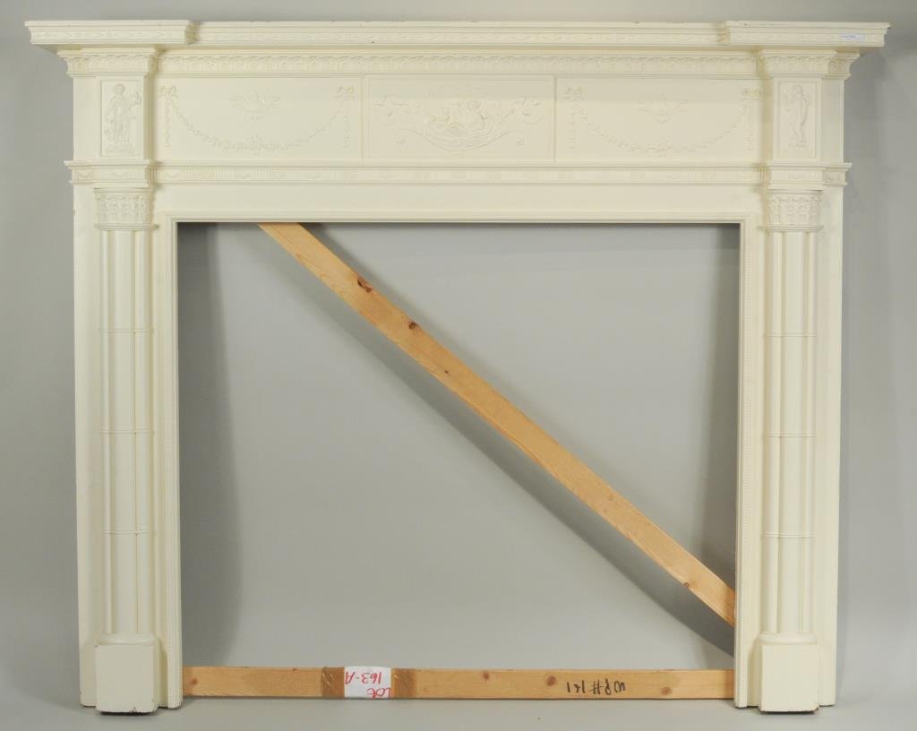 Federal Style Carved Neoclassical Fireplace Mantle: Federal style carved pine fireplace mantle, with floral and figural carving in the neoclassical taste. 57.5" high, 70" wide, 9" deep. Opening: 41.5" high, 47.5" wide. Provenance: private Connecticut c