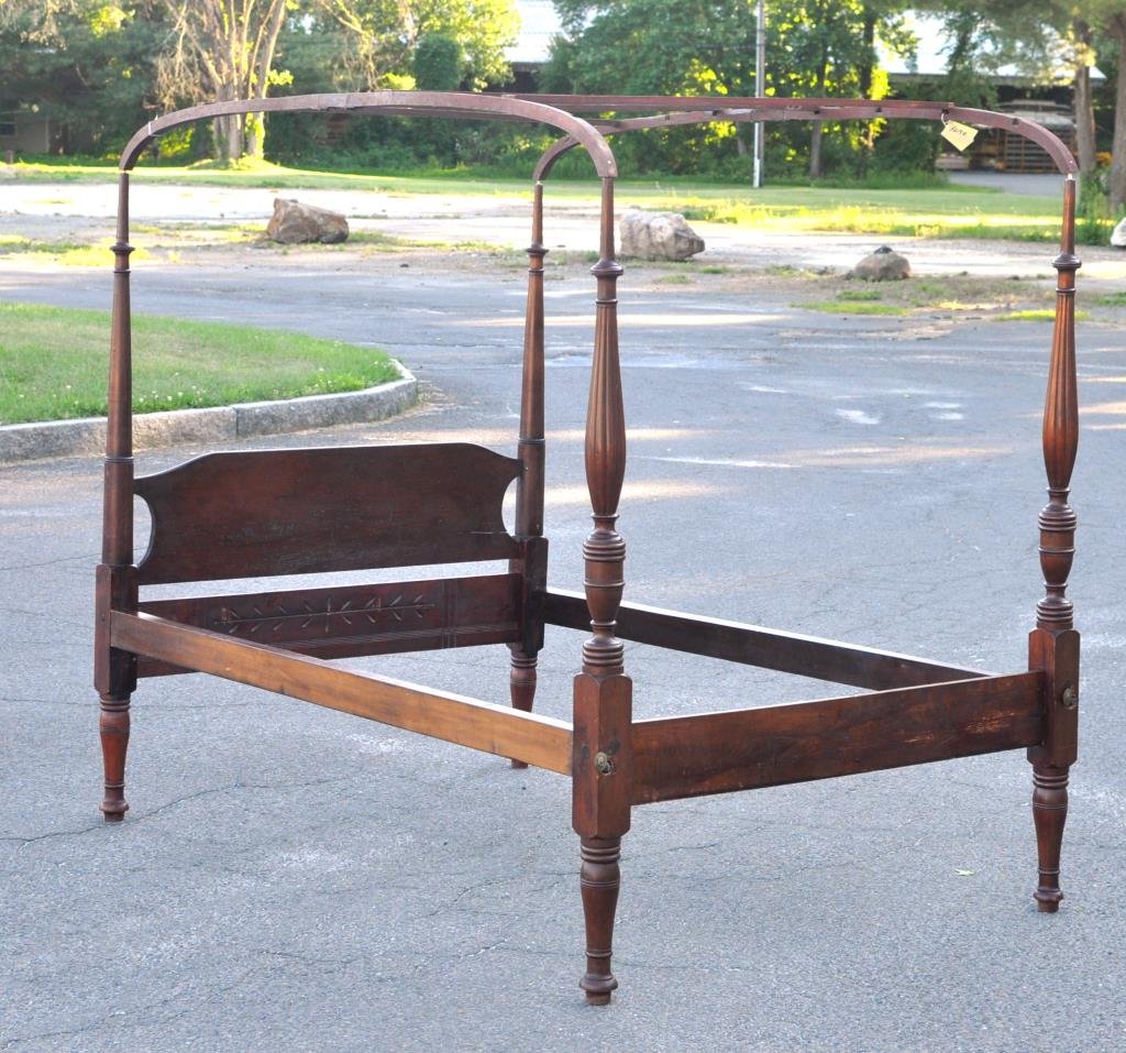 American Sheraton Mahogany Field Bed: American Sheraton carved mahogany tall post field bed, with shaped headboard, turned head and footposts, together with red painted pine tested frame, probably Massachusetts, 19th century. Posts 64" hi