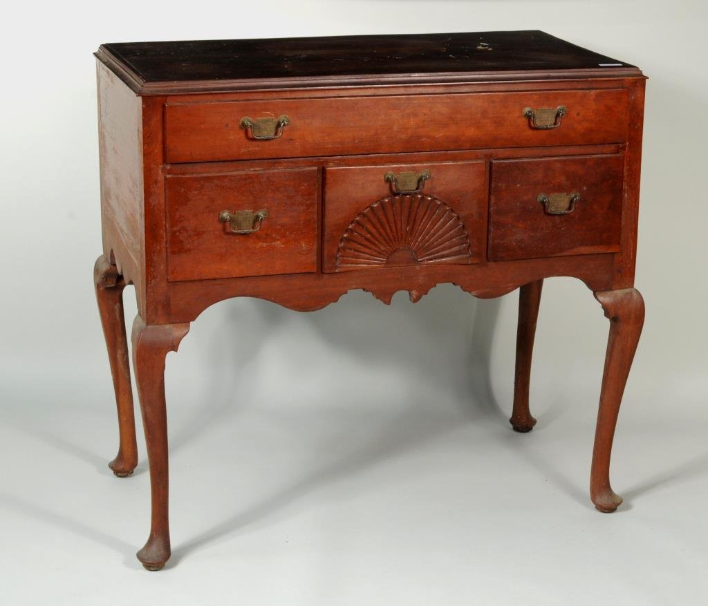 CT Queen Anne Cherrywood Highboy Base: Connecticut Queen Anne cherrywood highwboy base having one long drawer over central fan carved drawer flanked by deep drawers on pad feet. 35" high, 39" wide, 20 1/2" deep. Condition: finish wear, los