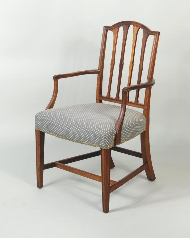 Hepplewhite Carved Mahogany Arm Chair: Hepplewhite carved mahogany arm chair with bowed crest and four flaring vertical slats. Salem, Massachusetts, c. 1790-95. (one slat restored). 38” high, 22” wide, 20” deep.