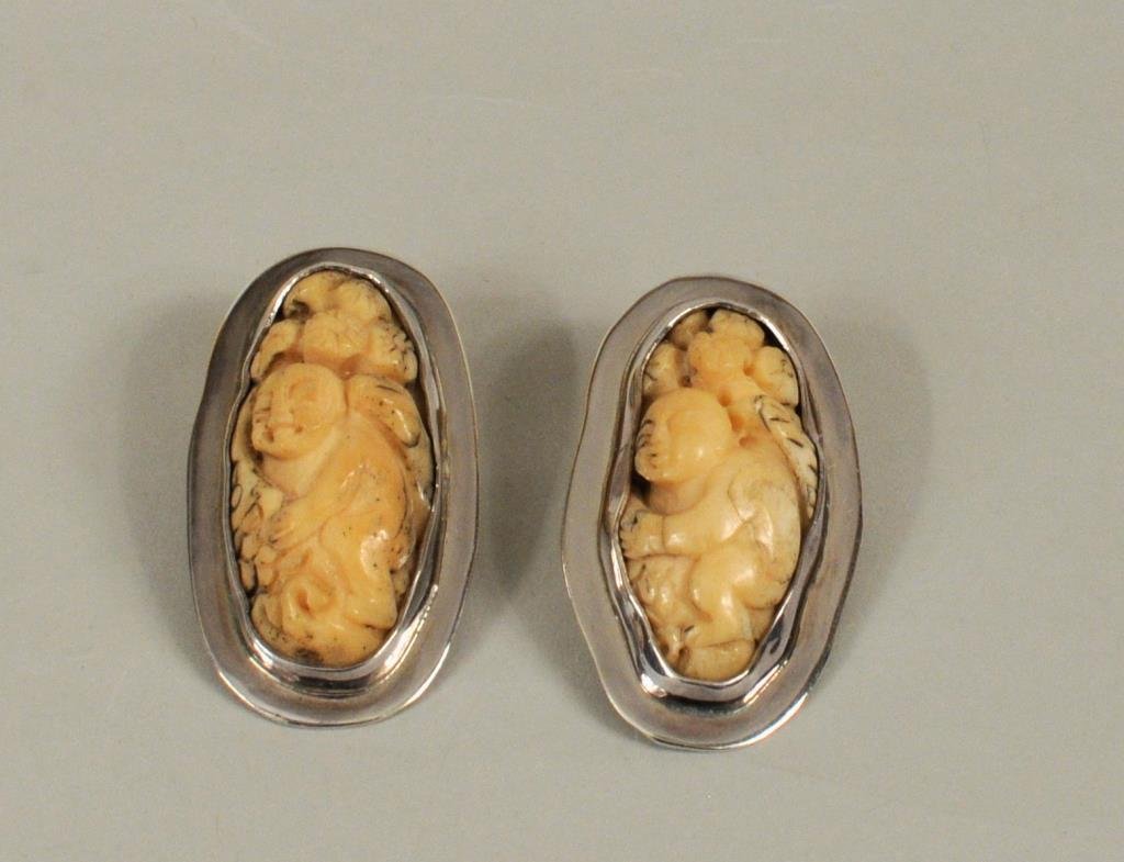 Pr Amy Kahn Russell Sterling Silver, Bone Earrings: Pair Amy Kahn Russell sterling silver and carved bone figural earrings stamped "AMK". 1 3/4" long, 7/8" wide. Gross weight: .64 OZT. Condition: lacking backs.