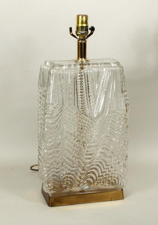 Unusual Modernist Lava Form Glass Lamp: Unusual rectangular modernist glass lamp in flowing lava form, set on brass base, 20th century. 18" high, 9" wide, 4 1/2" deep.