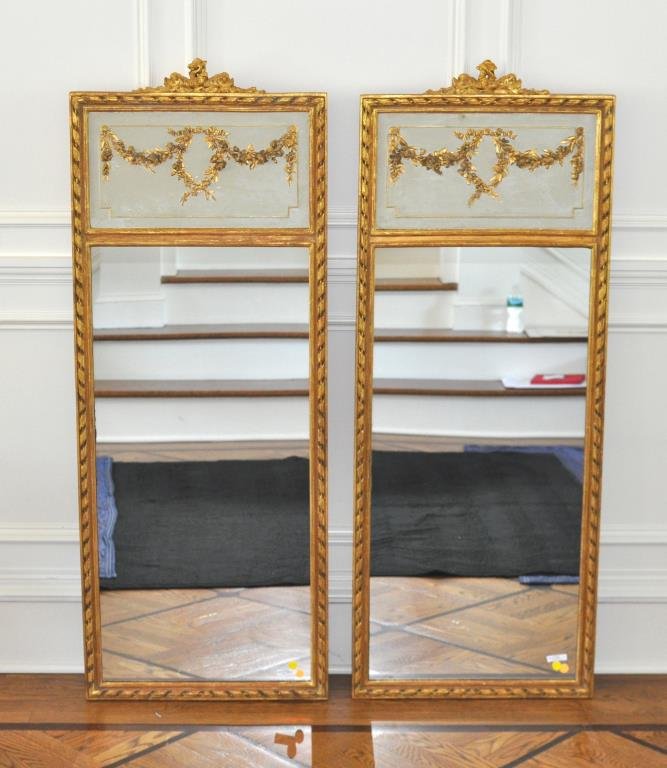 Pair Swedish Neoclassical Painted/Giltwood Mirrors: Fine pair of Swedish neoclassical painted and giltwood pier mirrors, having tablets with floral garlands above rectangular mirror plate within a ribbon carved molded frame. 19th century. 56" high, 21