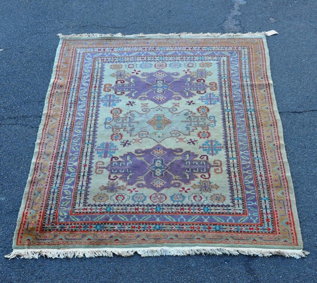 Caucasian Rug: Caucasian rug. 9' 4" long, 5' 11" wide. Condition: a few small stains. All rugs sold as is.