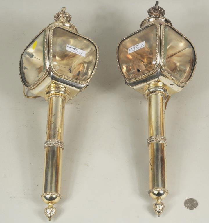 Pair English Victorian Silver Plate Coach Lanterns: Pair of English Victorian silver plate coach lanterns with royal crests, electrified. 20" long, 6 1/4" wide. Condition: plate wear, loss, dents, scratches to glass.