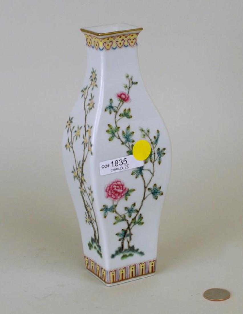 Chinese Porcelain Famille Rose Vase: Chinese porcelain famille rose vase, of squared baluster form decorated with flowering peonies and other blossoms, the base with four character mark. 9 1/4" high, 3 1/4" wide.