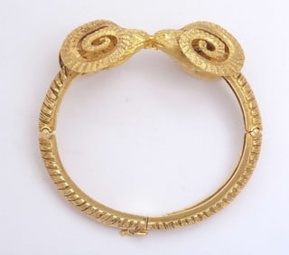 GOLD DOUBLE SHEEP HEAD BRACELET, SET WITH TWO FACETED RUBIES AND TWO FACETED SAPPHIRES