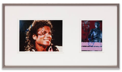 A PHOTO SIGNED BY MICHAEL JACKSON AND A TICKET