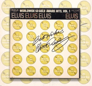 ELVIS PRESLEY (1935-1977) - INSCRIBED AND SIGNED "WORLDWIDE 50 GOLD AWARD HITS" COMPLETE 4-LP BOX