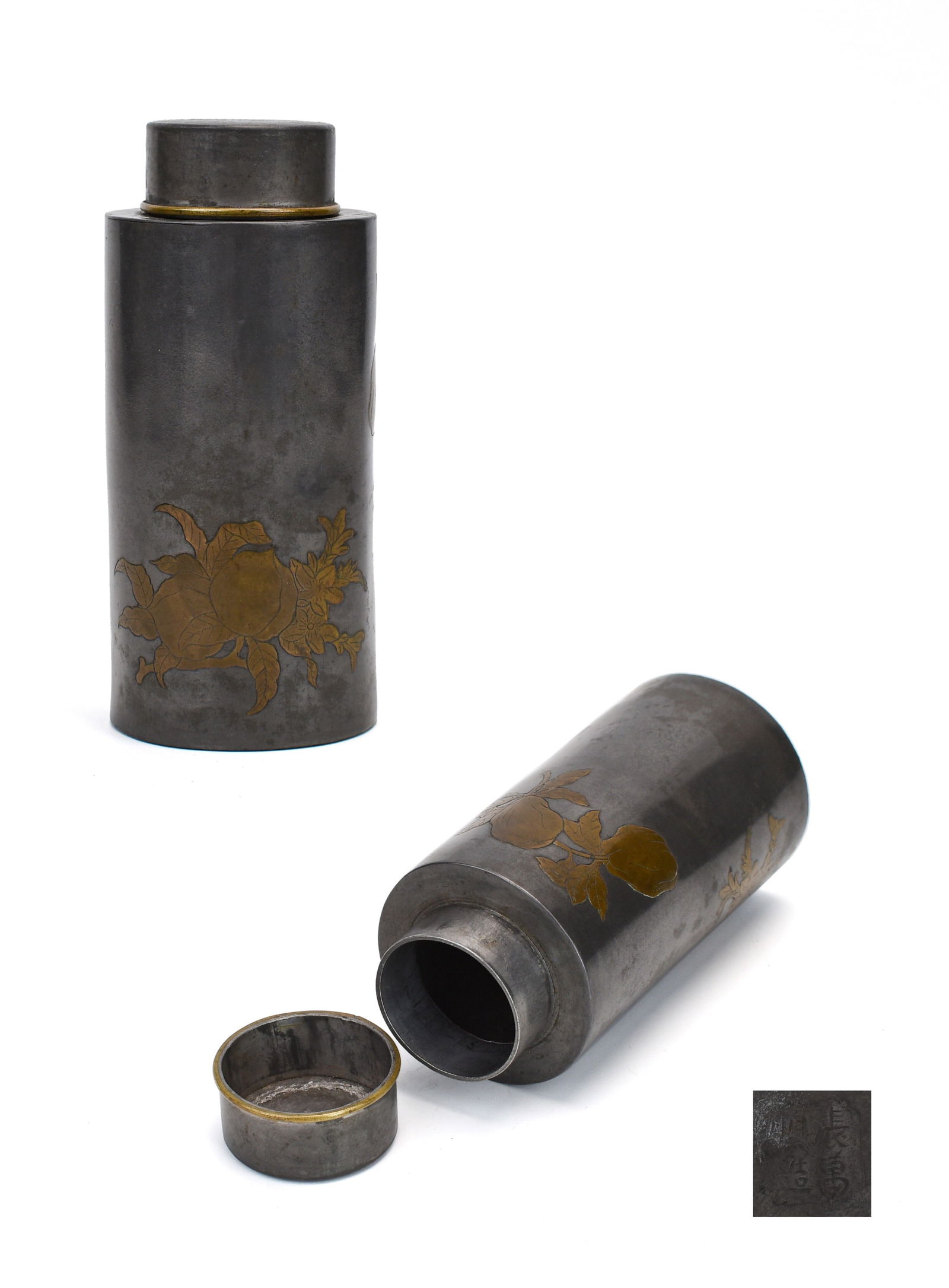 Wanshun Zhang (Qing Dynasty): Tin Tea Caddy: This refined pair of cylindrical tea caddies is crafted in tin, each decorated with inlaid copper floral motifs — including plum blossoms, peonies, and peaches — symbols of nobility, wealth, and l