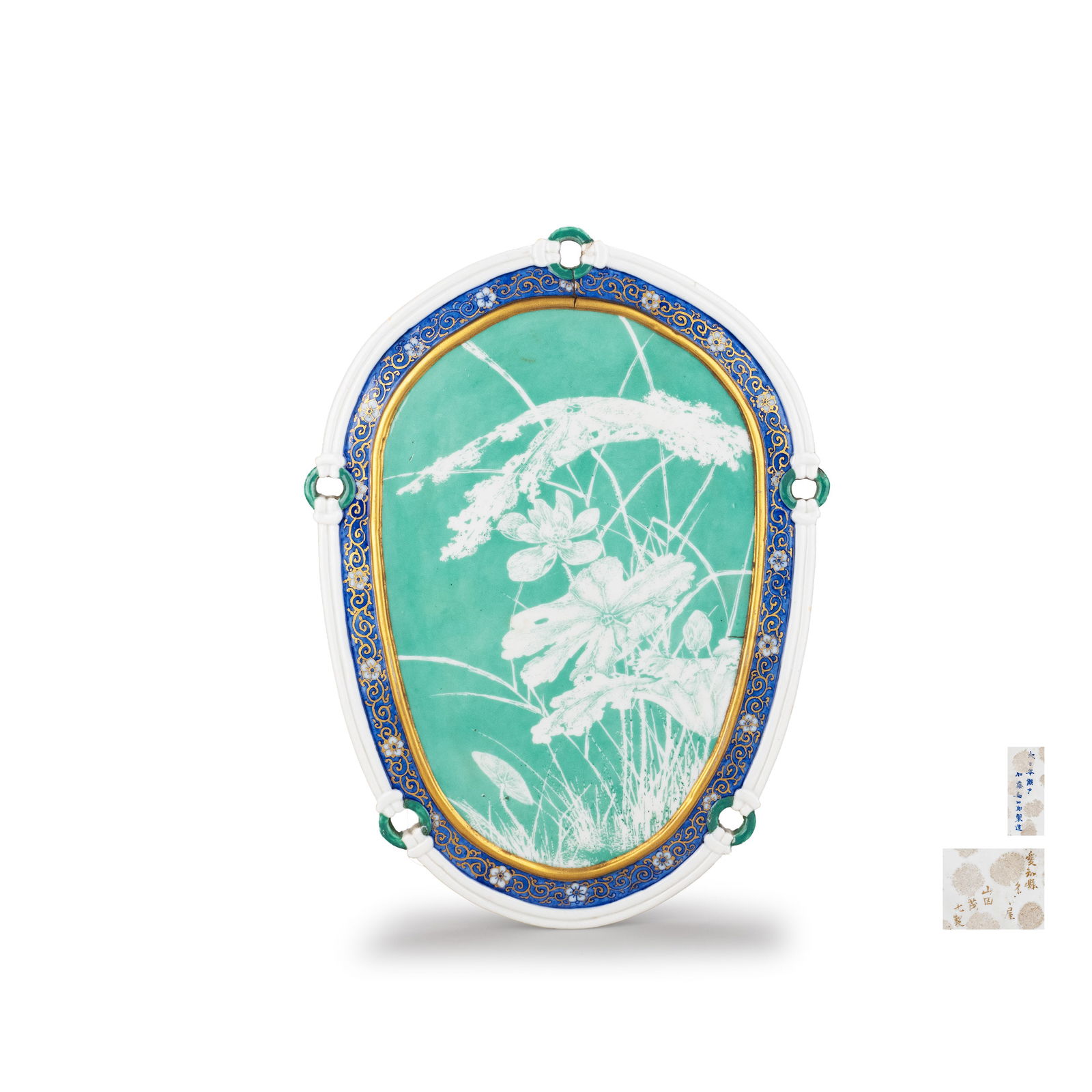 Seto Ware Porcelain Plaque by Kato Kanshiro: A finely executed Seto porcelain plaque by Kato Kanshiro, decorated with an elegant design of grasses and flowers reserved in white against a soft celadon green ground. The floral composition is rende