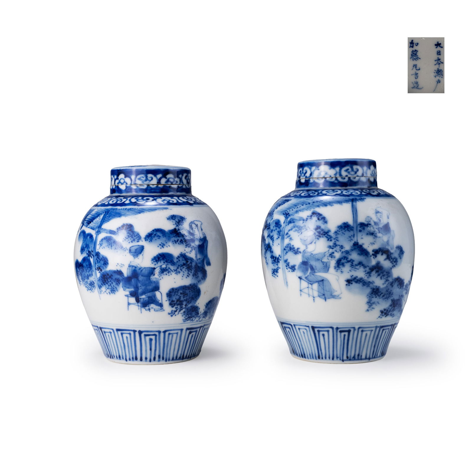 Pair of blue-and-white Seto tea caddies, Kato Kyukichi: This pair of tea caddies was made by Kato Kyukichi and is decorated with tea-picking scenes in underglaze blue. Each caddy has a rounded body with a short neck, forming a compact and well-balanced sha