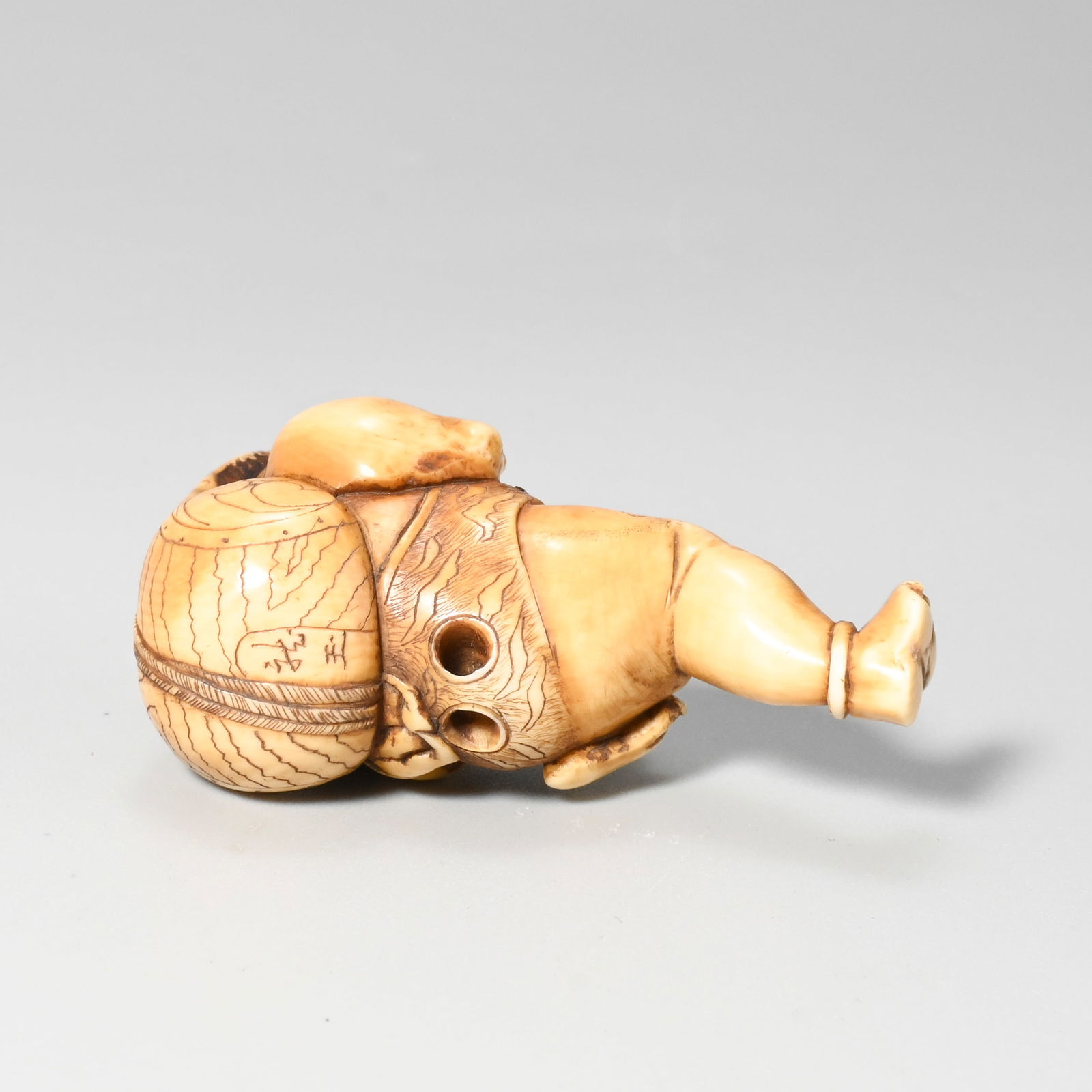 Three netsuke, signed - 10