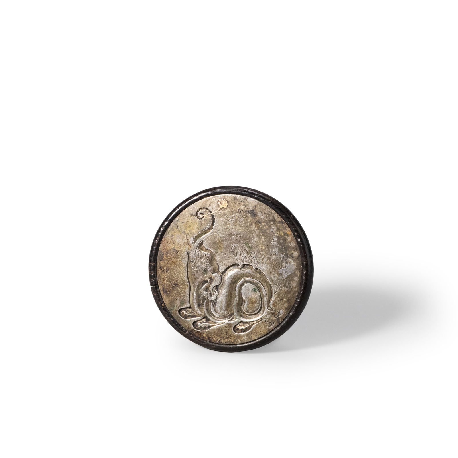 Netsuke by Maruyama ?kyo: This is a high-quality manju-shaped netsuke with a round wooden base inlaid with a metal mirror lid. The lid features a delicate engraving depicting the subject “Eguchi-kun," rendered with flowing l