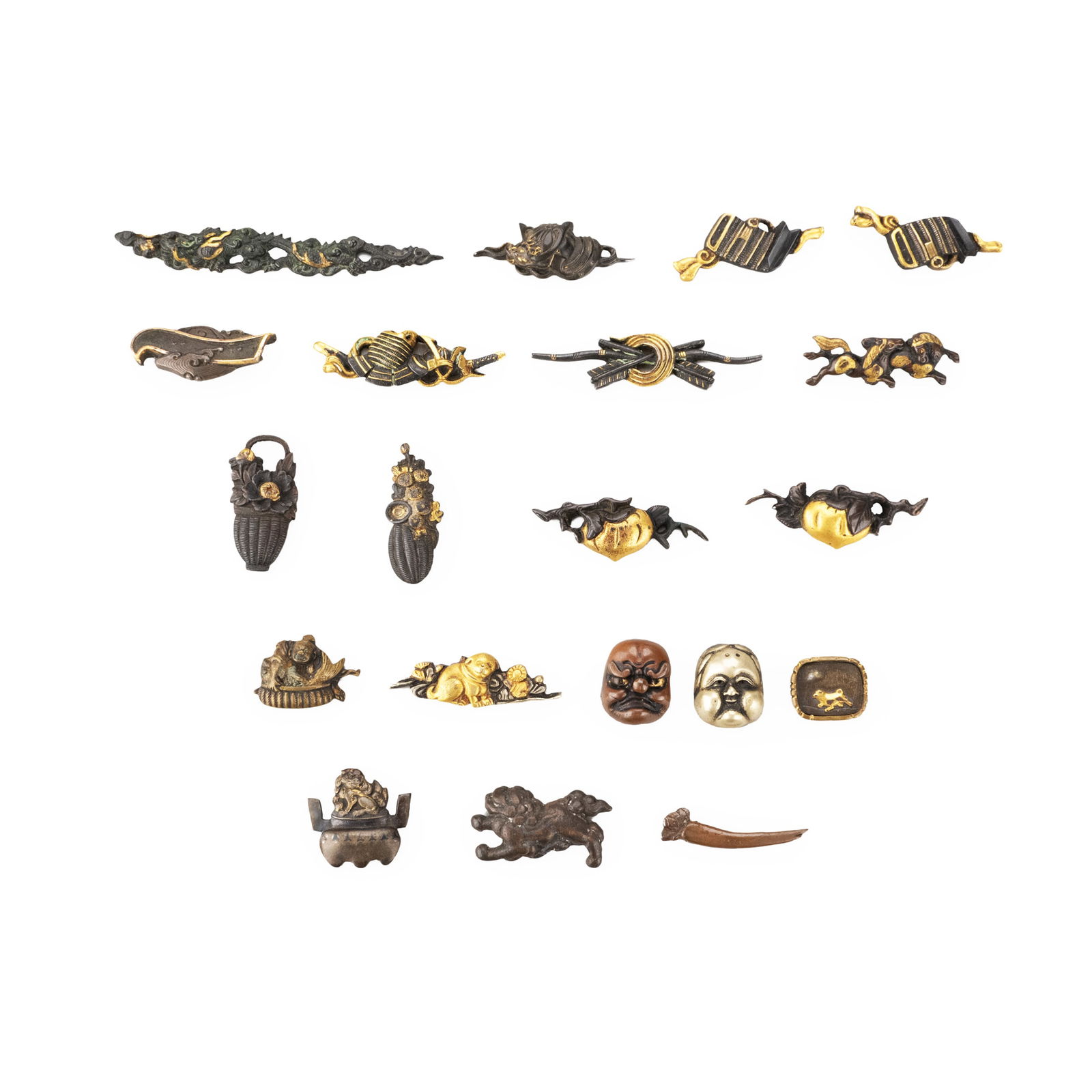 Twenty Metal Fittings: This lot consists of twenty metal fittings of varied forms and designs. Most are finished in dark-toned metal, accented in places with gilt highlights that emphasize details and contours. The motifs a