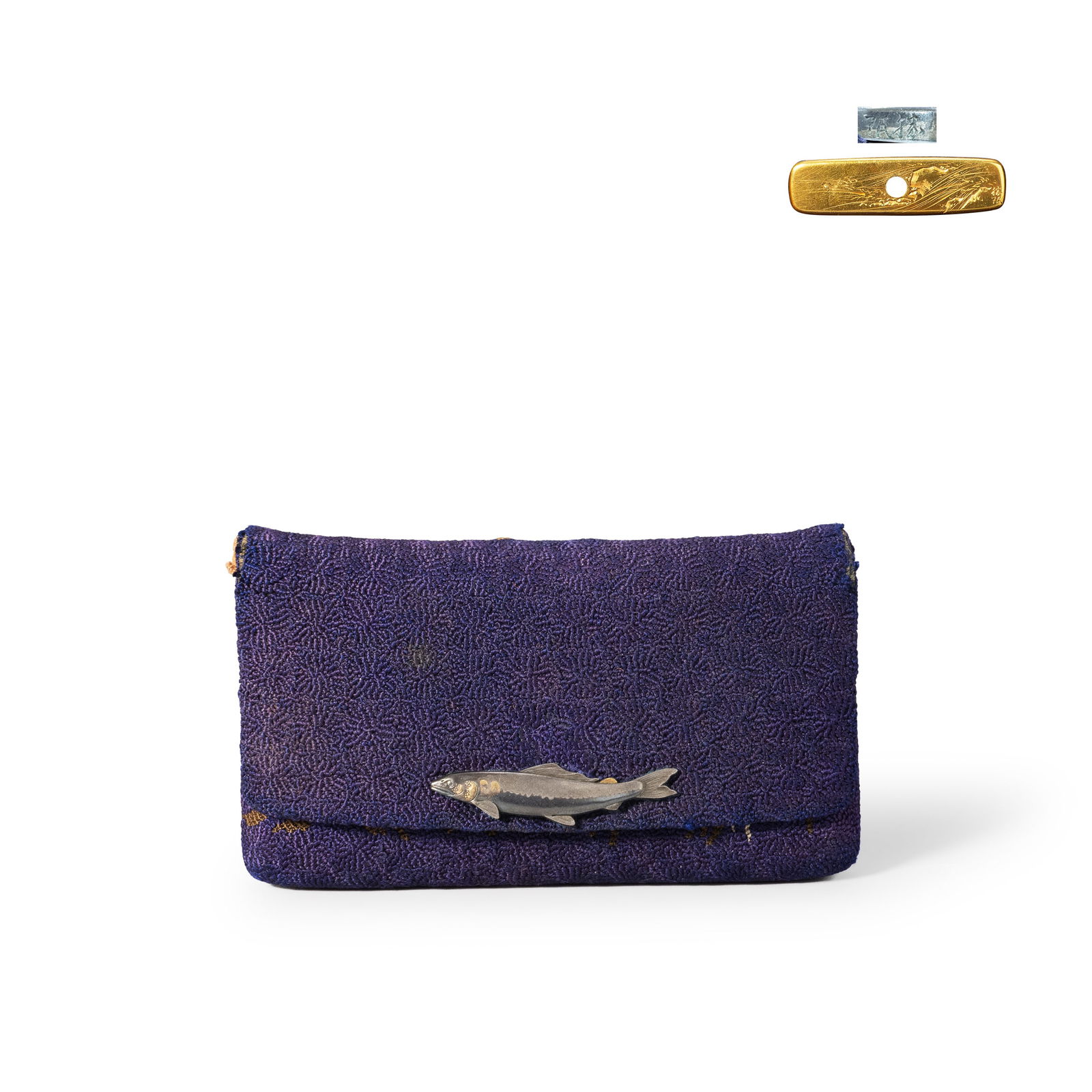Tobacco Case by Unno Katsumin: This work is a tobacco pouch with metal fittings by the renowned modern metalworker Unno Shomin. The pouch is made of purple fabric, with a realistic fish-shaped metal fitting on the front clasp. The