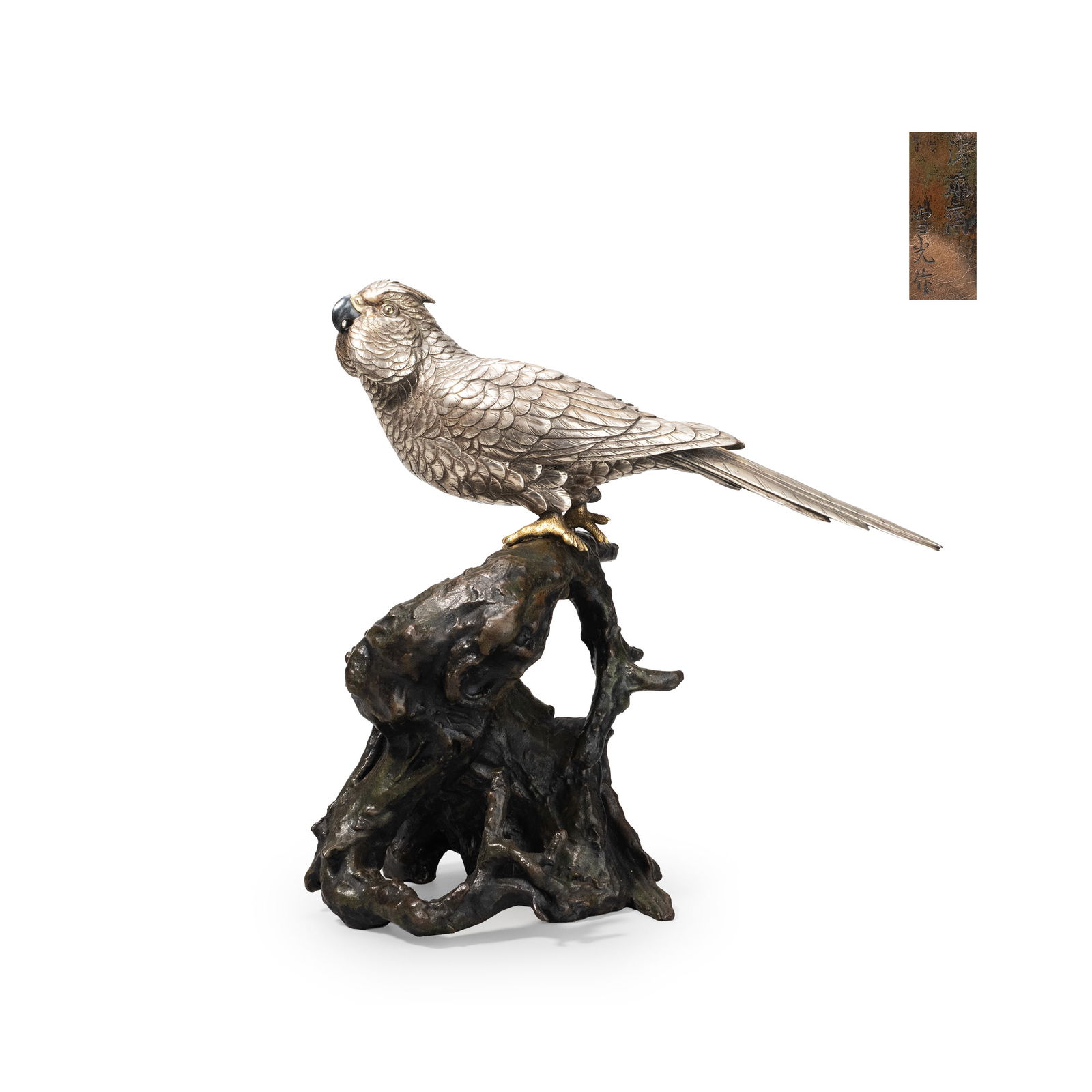 Parrot Ornament, Yukimitsu: This work is a metal sculpture that combines realism and decorative elegance, depicting a parakeet perched on a driftwood-style base. Each feather is carefully engraved, with overlapping structures me