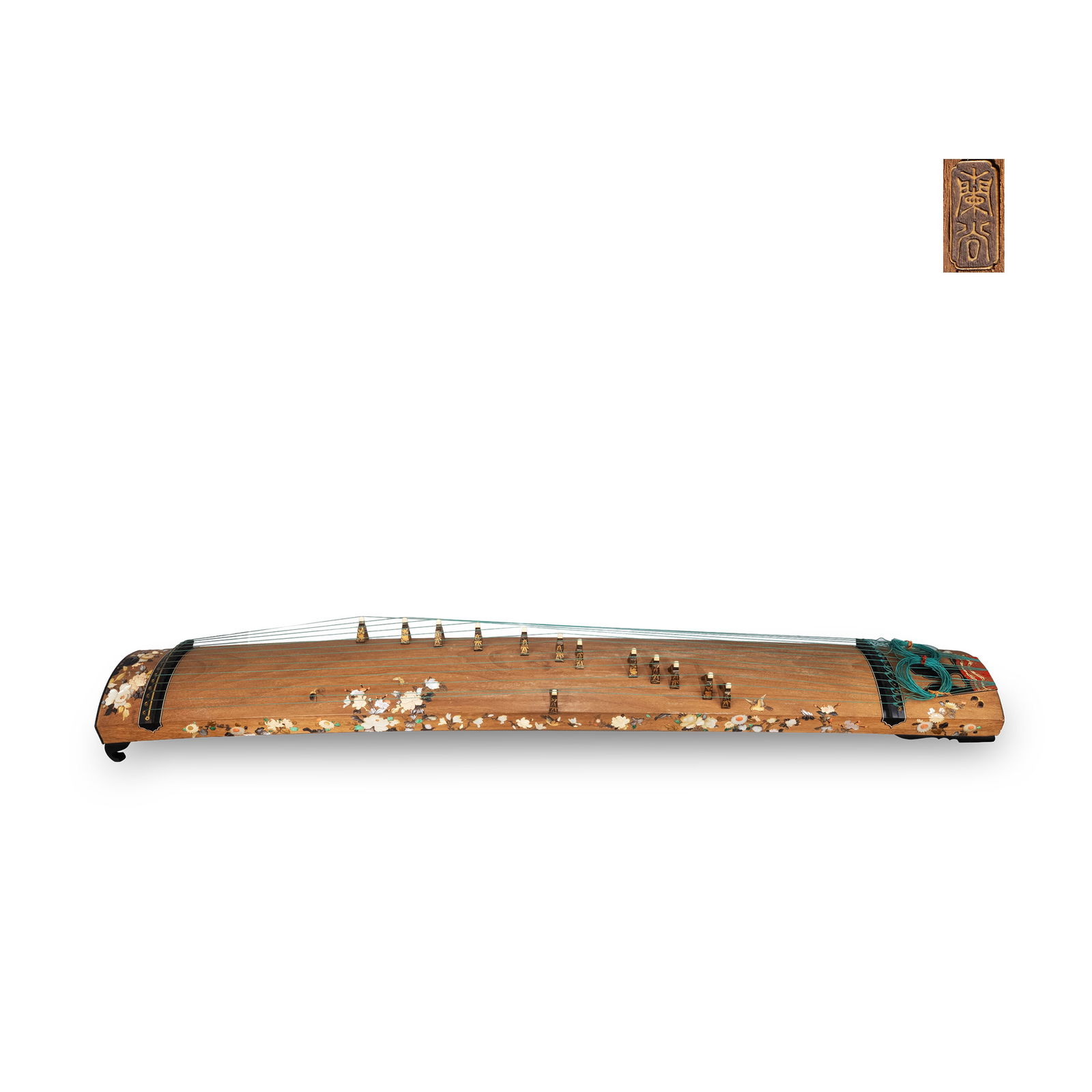 Shibayama-inlaid 13-string Koto by Rankoku: A thirteen-string koto signed “Rantani," richly decorated in the Shibayama inlay technique. The wooden body is adorned with finely composed floral motifs including peonies, chrysanthemums, and butte
