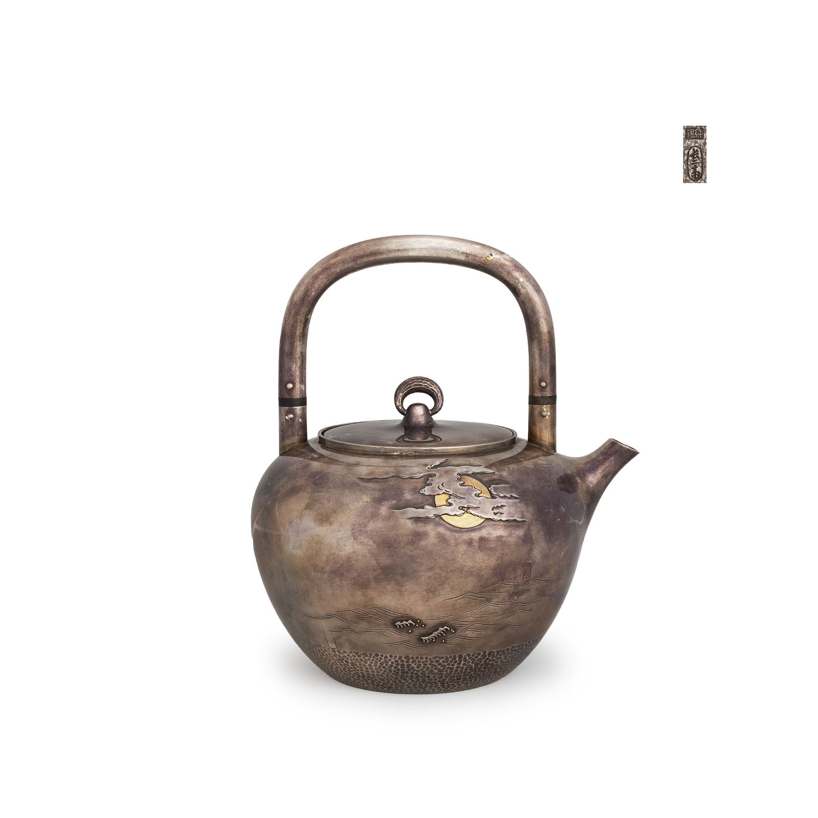 Pure Silver Tea Kettle with Gold Inlay by Ch?jisai Suzuki: A finely formed pure silver kettle of rounded silhouette, its softly variegated silver surface serving as a subdued ground for a nocturnal seascape rendered in carving and gold inlay. A full moon in