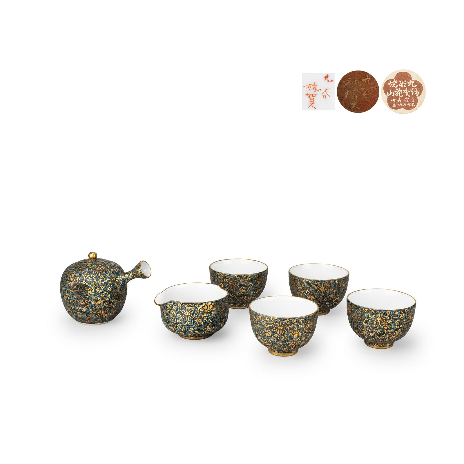 Kutani Kaga Sencha Tea Set: A Kutani “Naka" sencha tea set, decorated in aochibu [blue stippling] with dense gilt scrolling vines and floral motifs. The gilded rims and spouts create a rich contrast against the finely dotted