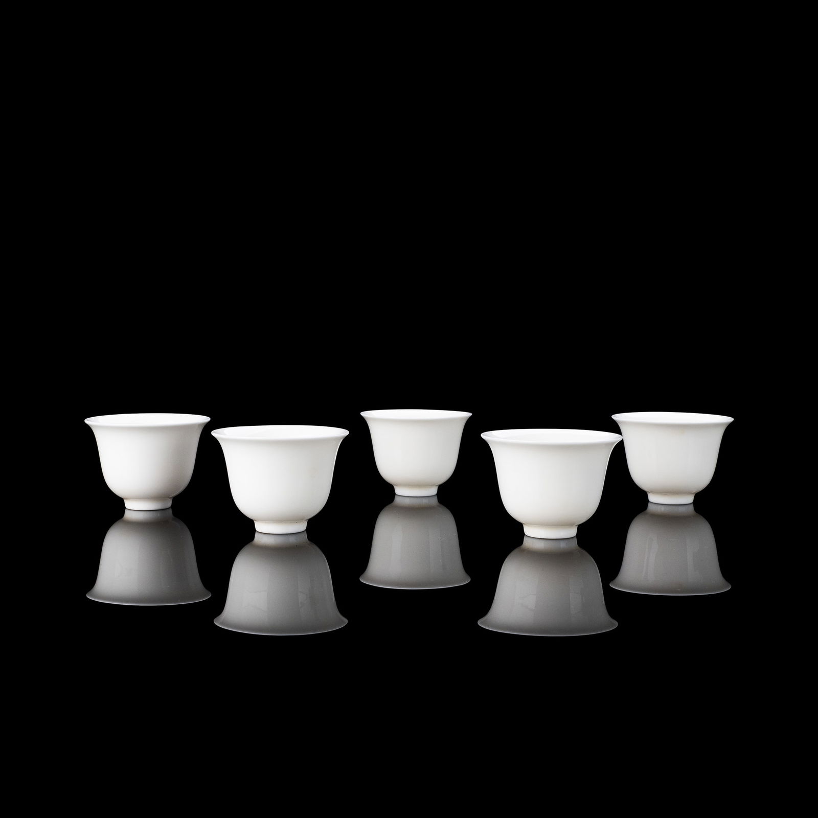 Set of 5 Blanc de Tokei Porcelain Tea Bowls: This set of five white porcelain tea bowls is well proportioned and elegantly restrained in form. The shapes are simple and balanced, conveying a subtle and understated beauty that reflects the