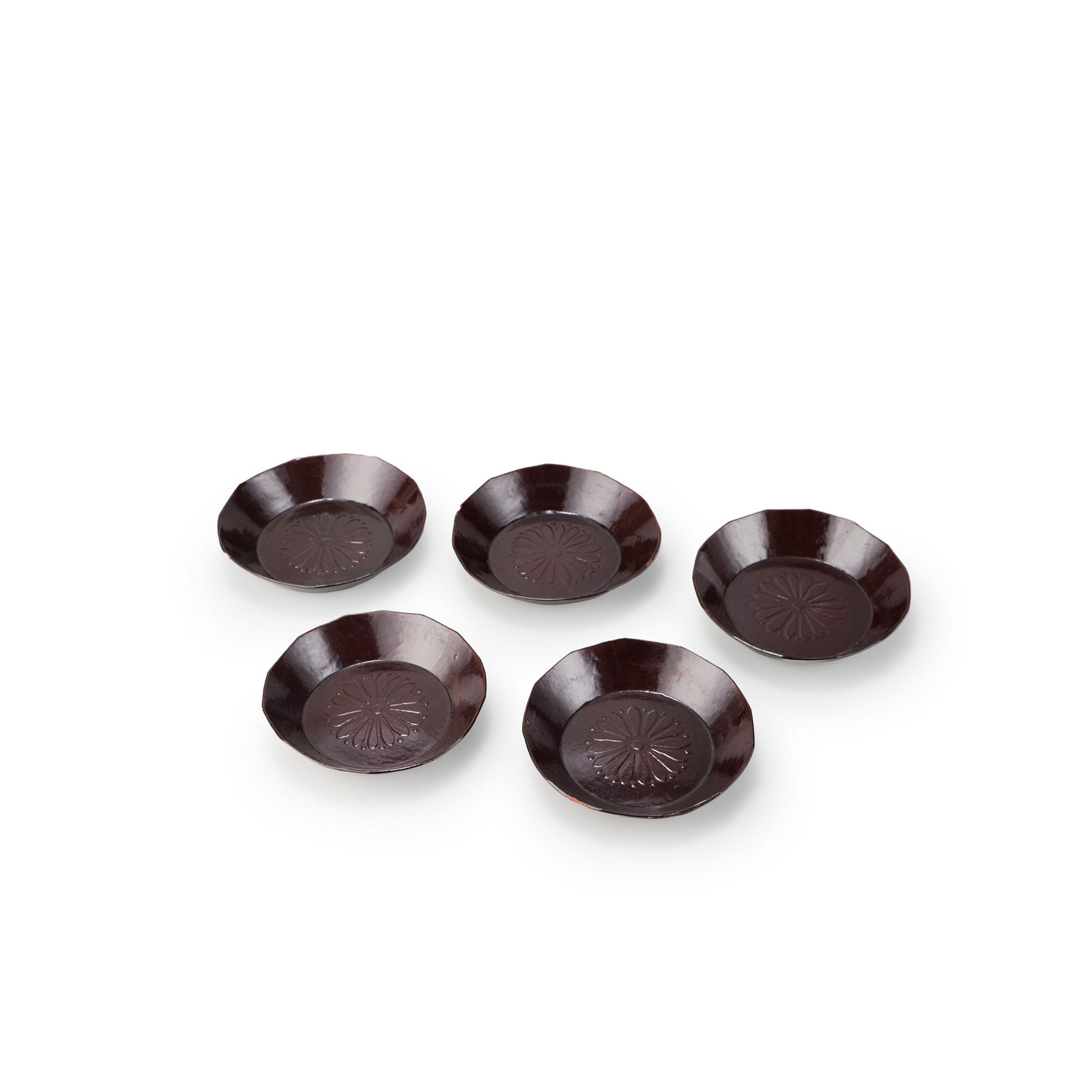 Set of Five Candy Plates: This set comprises five confectionery trays executed in the Ikkanbari technique, constructed by layering paper over a shaped core and finished with a dark lacquered surface of restrained sheen. Each t
