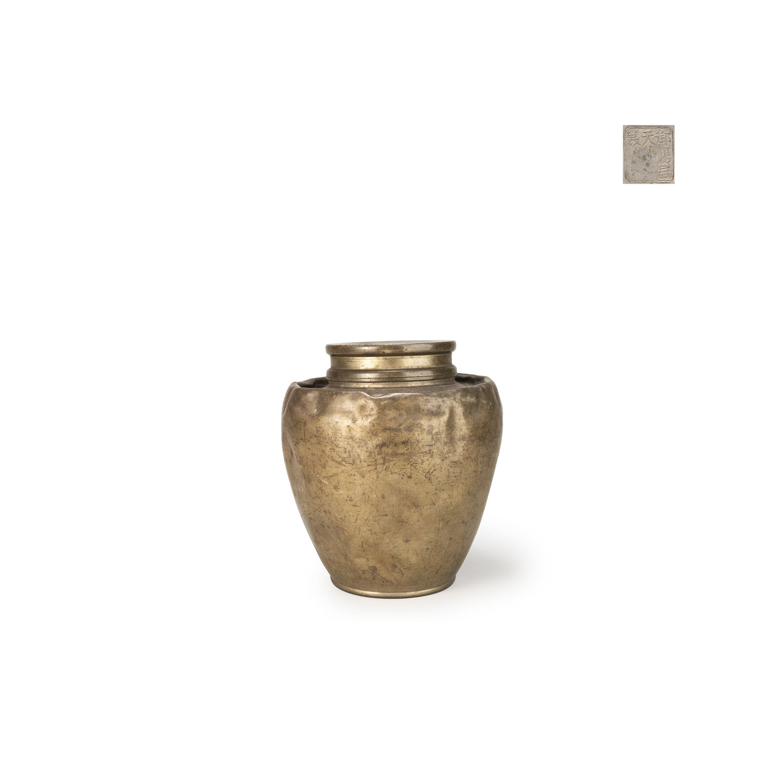 Pewter Teapot by Gosekiya Tenkaichi Mamoru: This is a pewter tea jar bearing the incised mark “Tenka Ichigi saku Mamoru-z?" on the base. The vessel has a gently rounded body with a slightly raised shoulder and a stepped rim, forming a stable