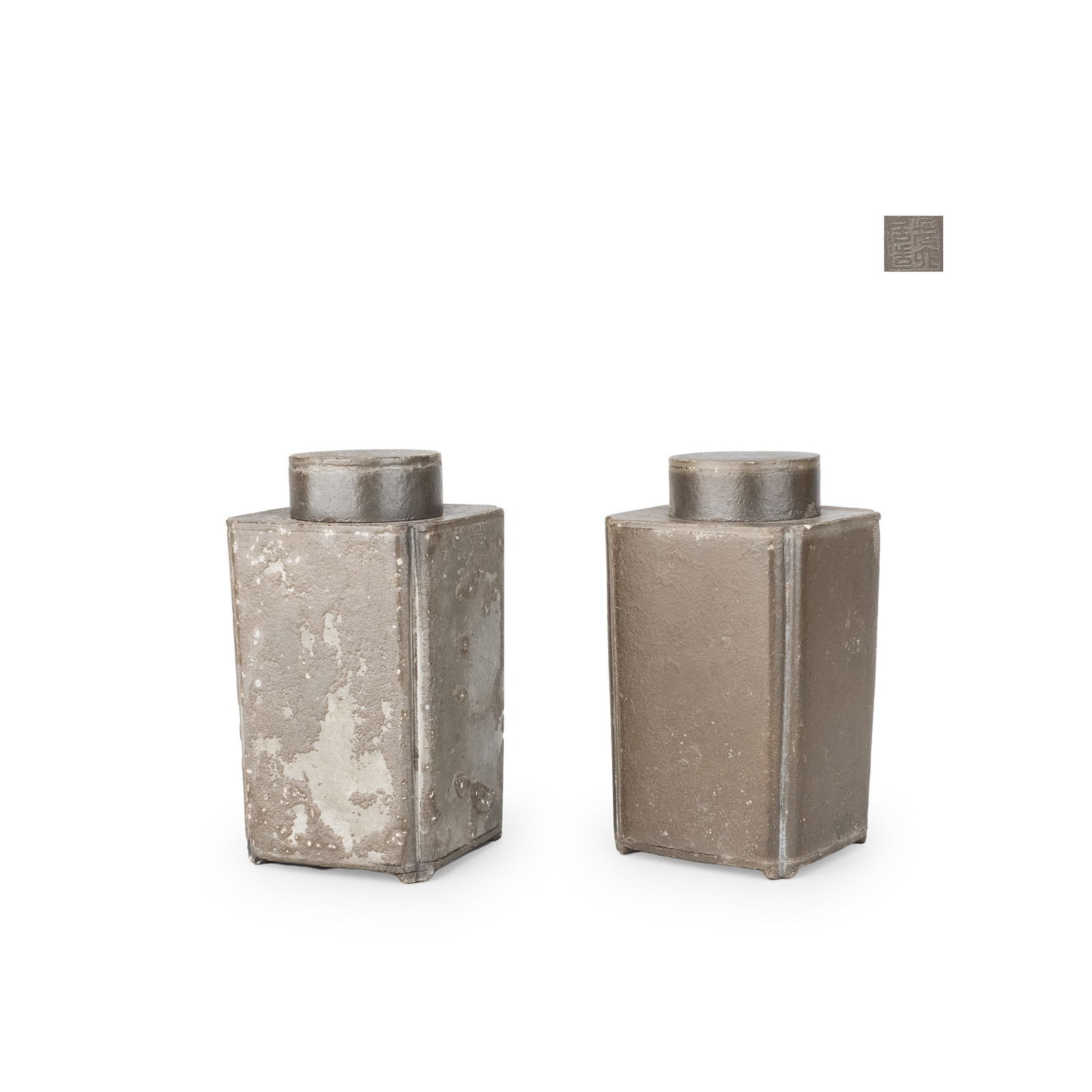 Pair of square pewter tea caddies, Zoroku: A matched pair of square-section pewter tea caddies by Kuraku. Each piece is formed with a clean, rectilinear body and a simple mouth, the subdued gray surface expressing the characteristic texture