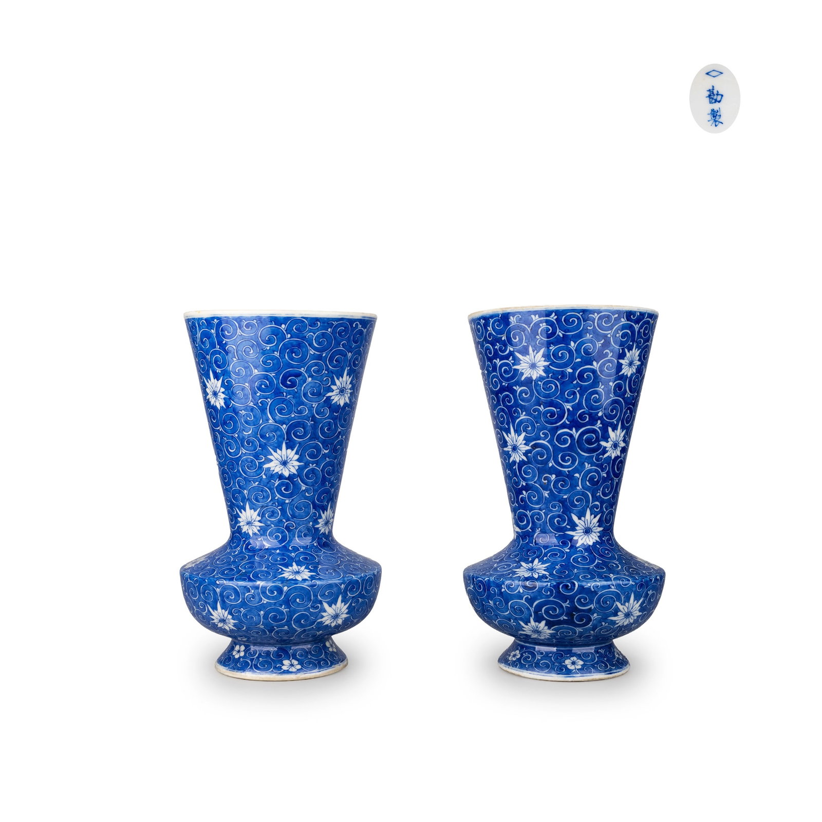 Pair of Vases by Kato Kanshiro: This pair of Seto ware vases is by Kato Kanshiro, featuring an elegant form with a rounded lower body rising to a tall, slender neck on a stable foot.The surfaces are densely covered with scrolling ka