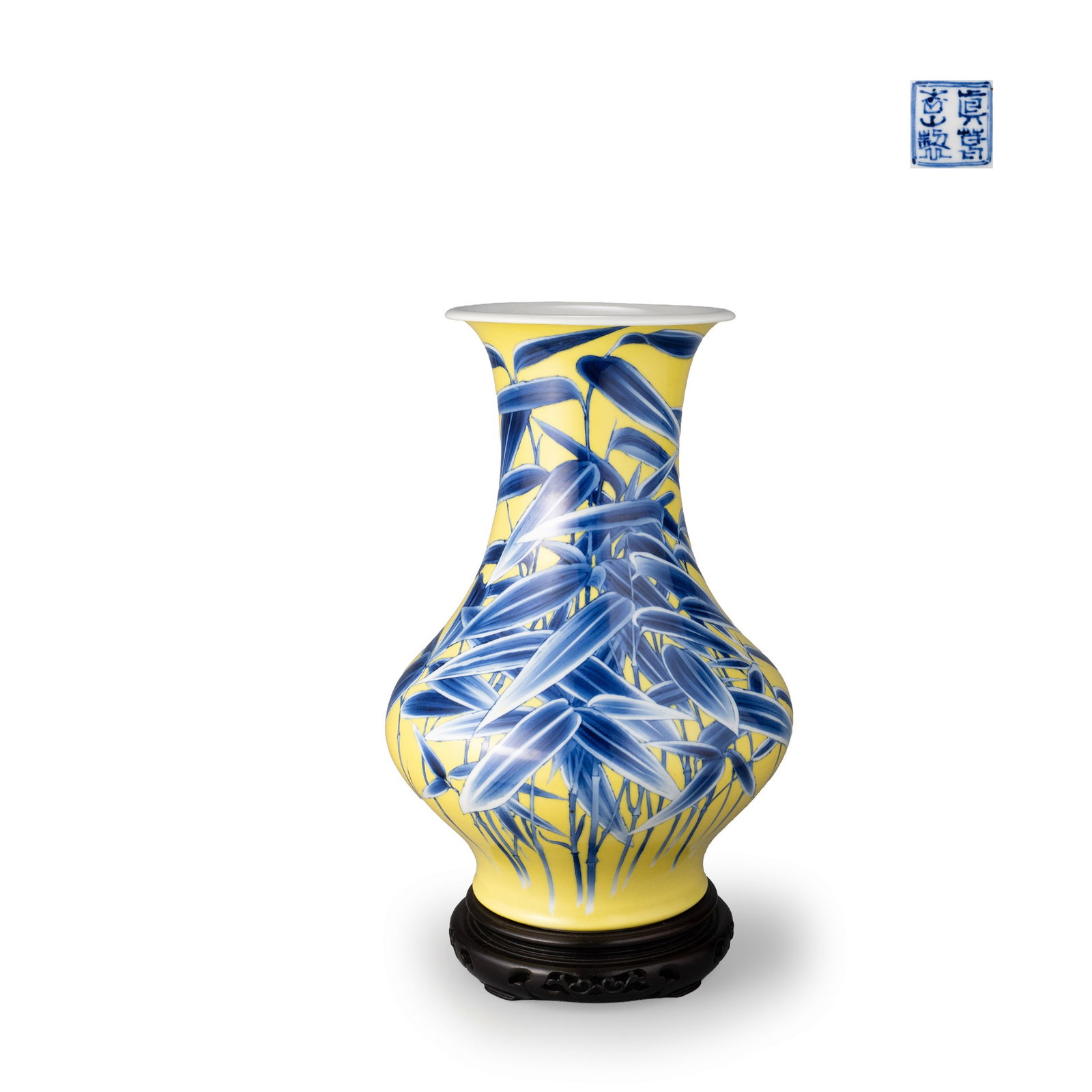 Vase by Makuzu Kozan: This vase is finished in a vivid and luminous yellow glaze, over which bamboo is rendered in underglaze cobalt with remarkable fluidity.The elegant form, with its gently swelling body and slightly fla