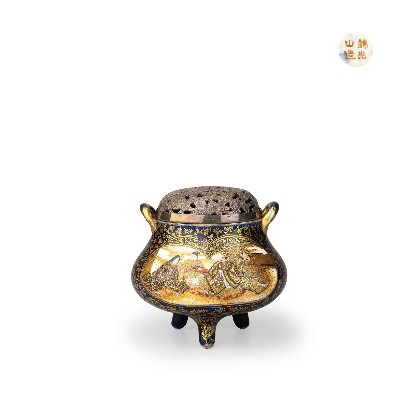 Incense Burner by Kinkozan: The vessel is formed as a rounded tripod censer with paired handles, covered in a deep cobalt-blue glaze and richly embellished with dense gilt ornament. The reserved panels on the body depict classic