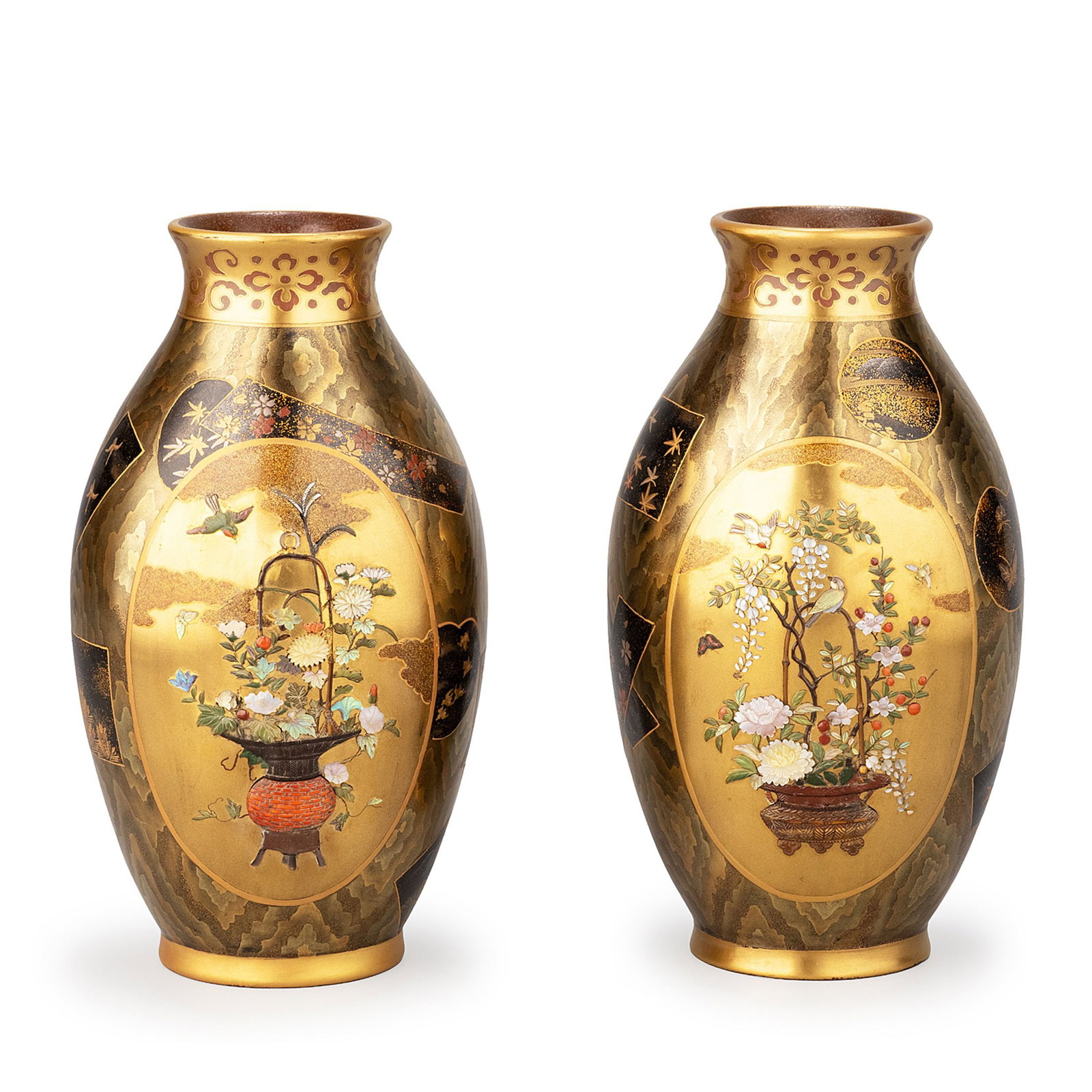 Pair of Gold Maki-e Vases: Against a softly shimmering gilt ground, seasonal flowers, birds, and butterflies unfold in richly varied compositions. Floral arrangements, fruiting branches, and cascading blossoms occupy individual