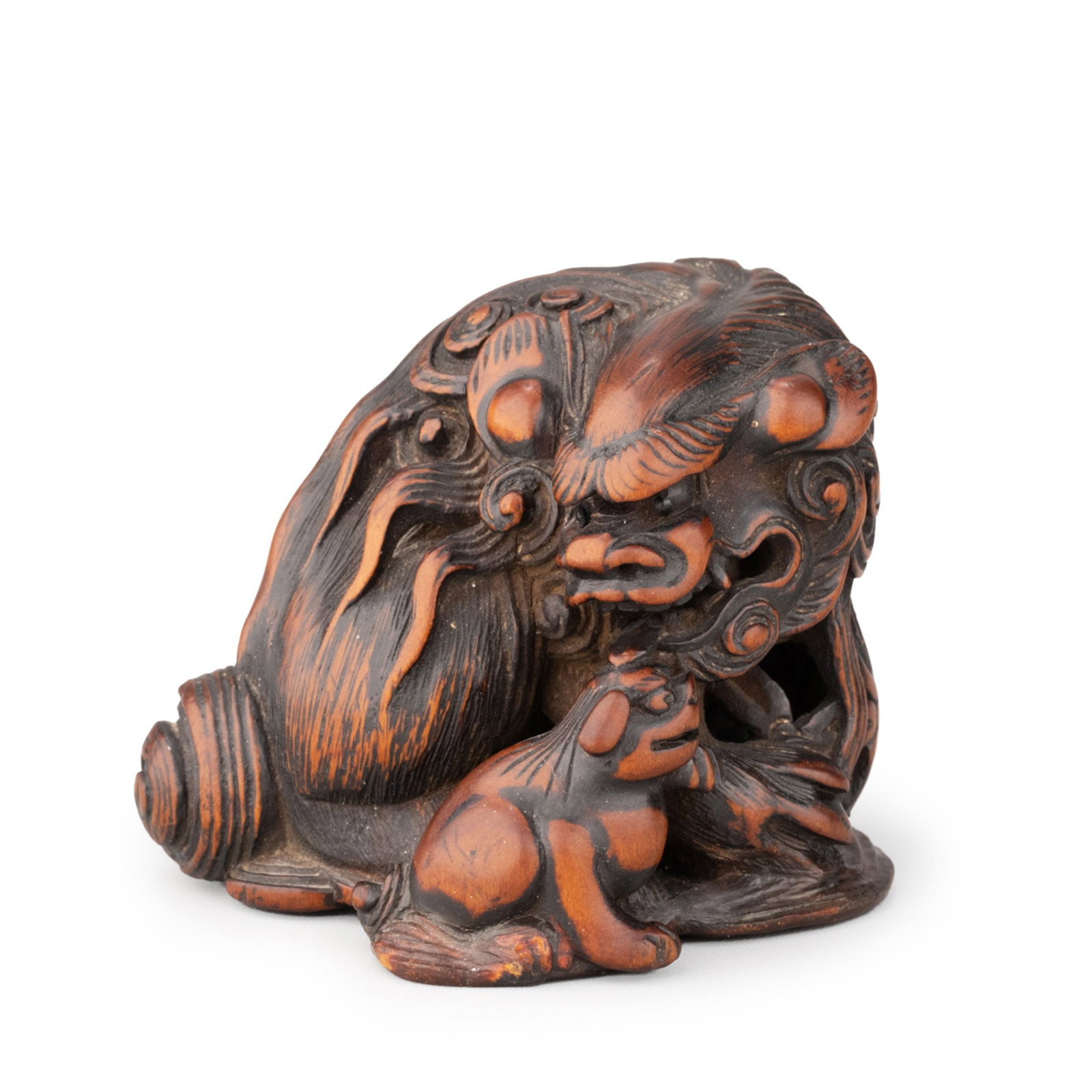 Netsuke by Masatomo: The composition captures a tender interaction between the protective parent and the young cub, symbolizing protection, prosperity, and good fortune.Expertly executed in high relief with openwork detai