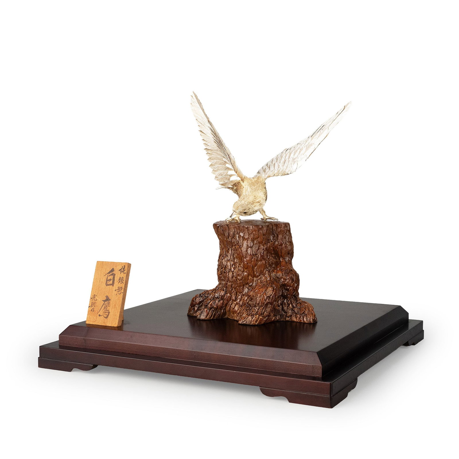 Pure Silver Okimono by Mitsunori: The hawk is captured in a dramatic hunting posture, wings fully extended as it prepares to descend upon its prey. Every feather has been individually chased and engraved with remarkable precision, cre