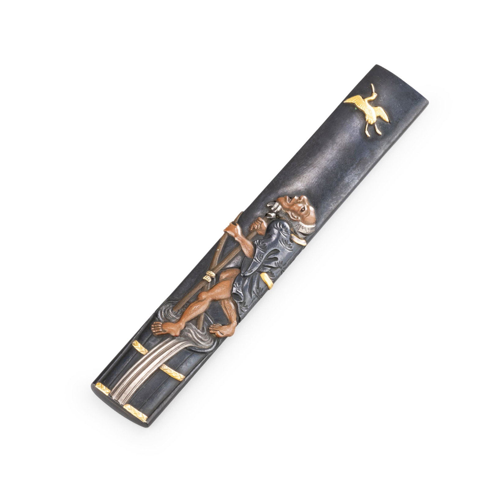 Copper Kozuka by Hamano Noriyuki: Decorated with a figure holding a long staff, modeled in pronounced relief within the narrow surface of the piece. A crane in flight appears above, while the facial features, folds of the robe, and mo