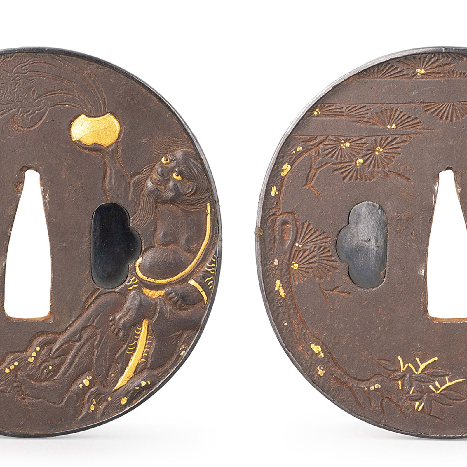 Gold-Inlaid Rakan and Pine Tsuba: This iron tsuba is finely decorated with a standing Arhat beneath sweeping pine branches, enriched with delicate gold inlay that highlights selected details of the composition. The expressive figure, 
