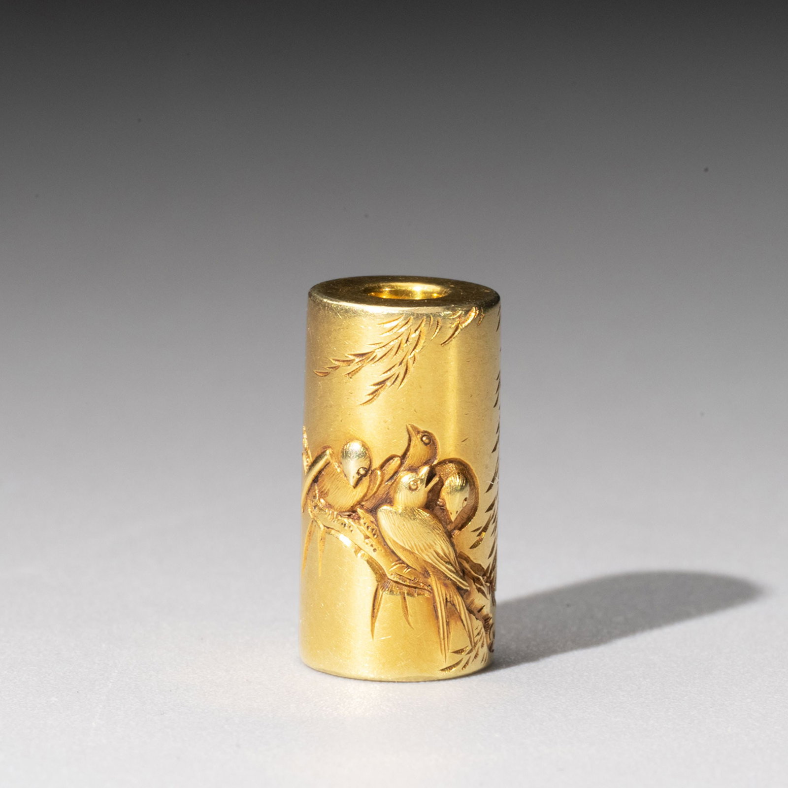 Ojime by Juraku,K18 Certificate: Decorated in high relief with swallows resting among willow branches. The birds are rendered in varied poses, creating a lively and balanced composition that captures the elegance and vitality of natu