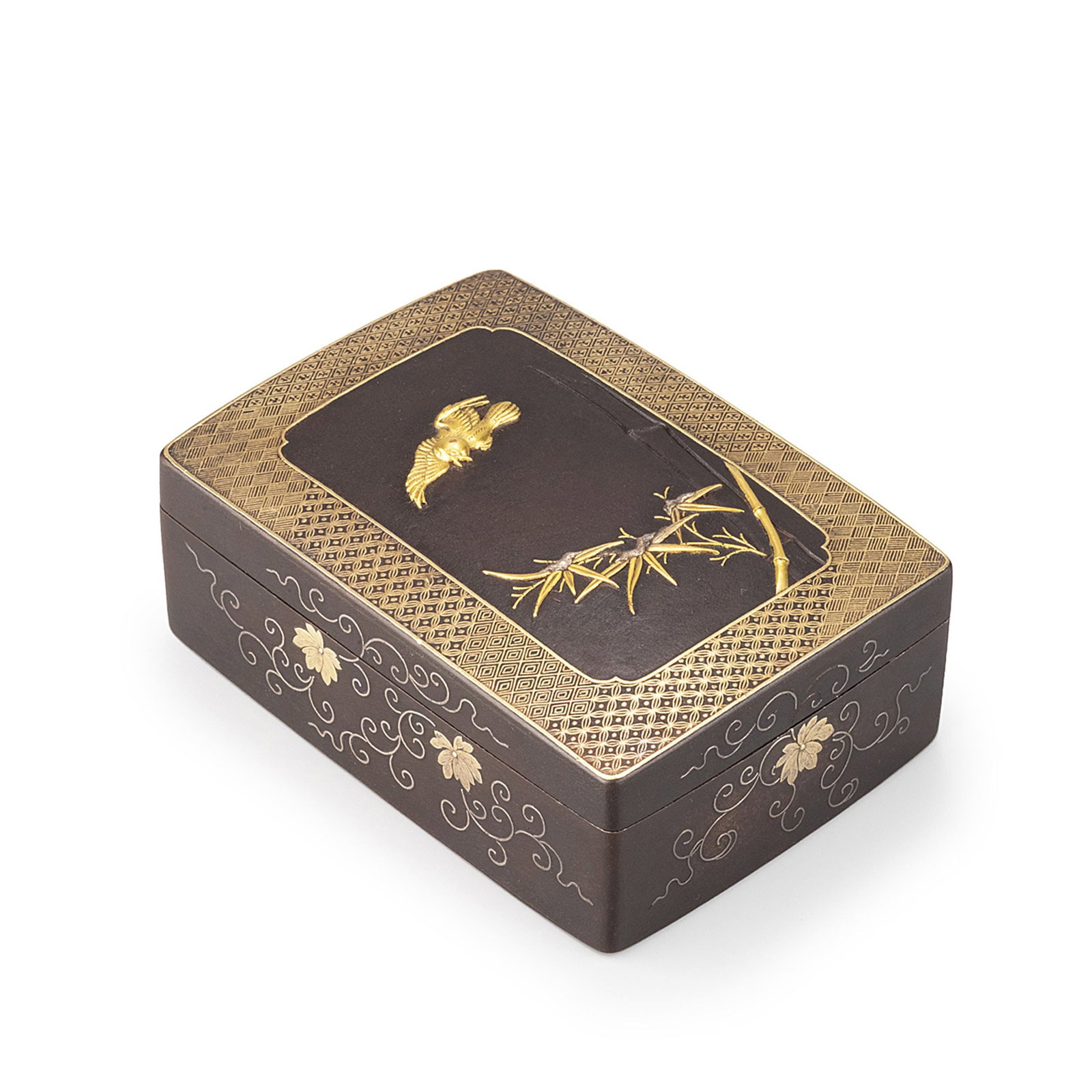 An iron box with gold and silver inlay: Decorated with gold and silver inlay. The cover is centered with a lively sparrow in flight above bamboo rendered in contrasting precious-metal inlays, framed by an intricately engraved geometric bord