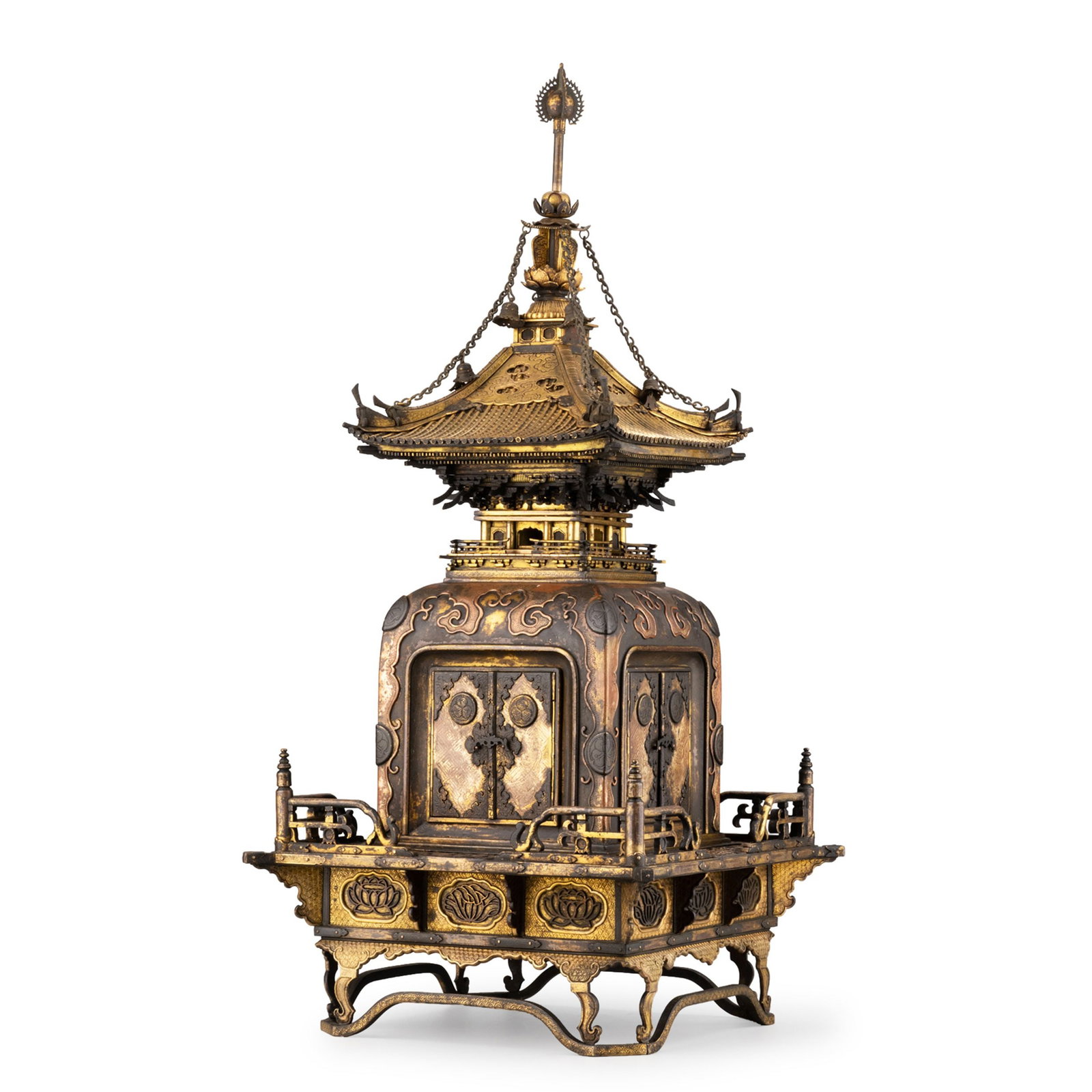 Gilt Copper Reliquary Pagoda, Signed: This finely crafted gilt bronze reliquary pagoda is modeled after a traditional Buddhist temple structure, featuring an elegant tiered roof with gracefully upturned eaves surmounted by a soaring finia