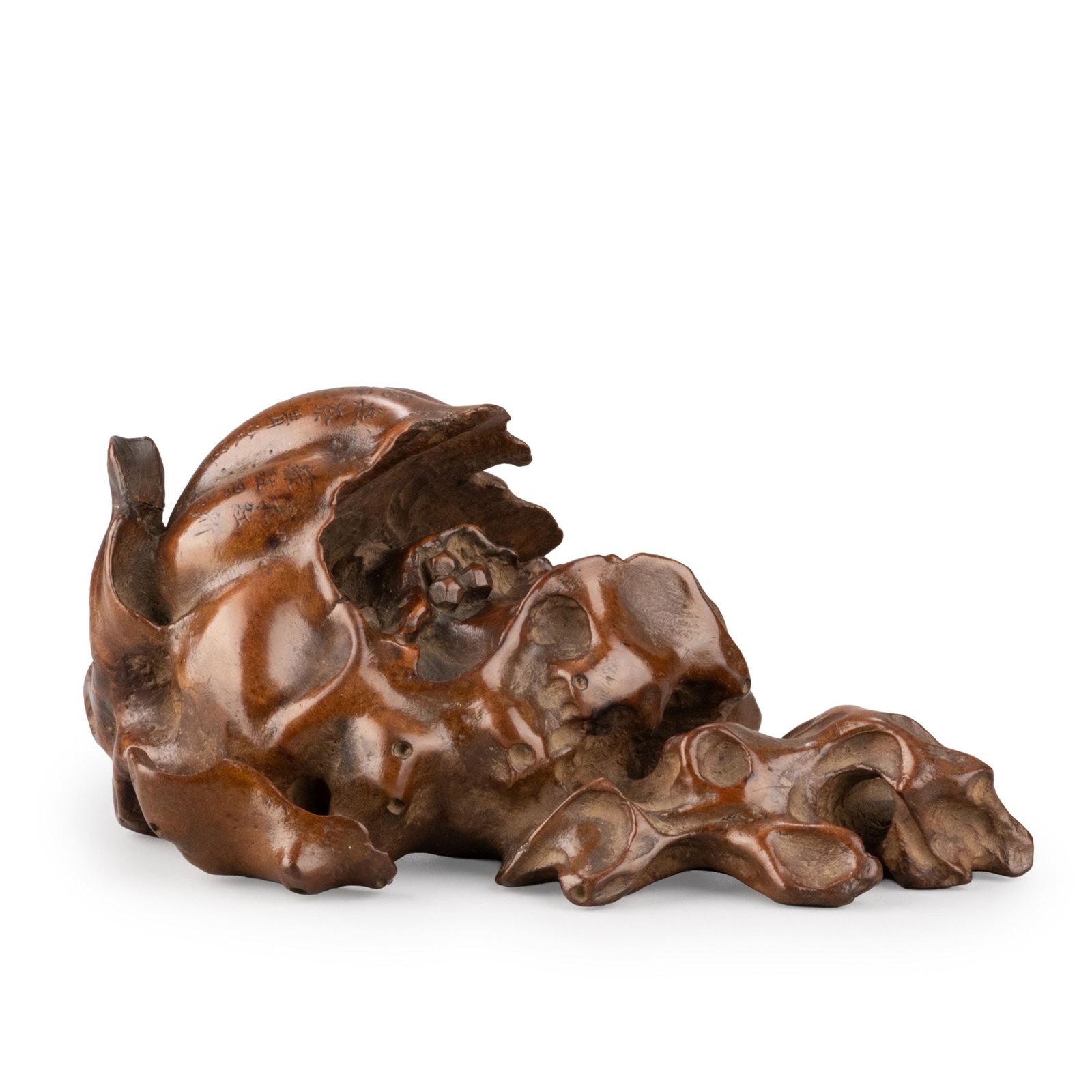 Paperweight by Unpeki, Tomobako: This finely carved scholar's paperweight by Unpeki is fashioned in the form of a ripe pomegranate split open to reveal its clustered seeds. The curling rind, exposed fruit, and accompanying foliage ar