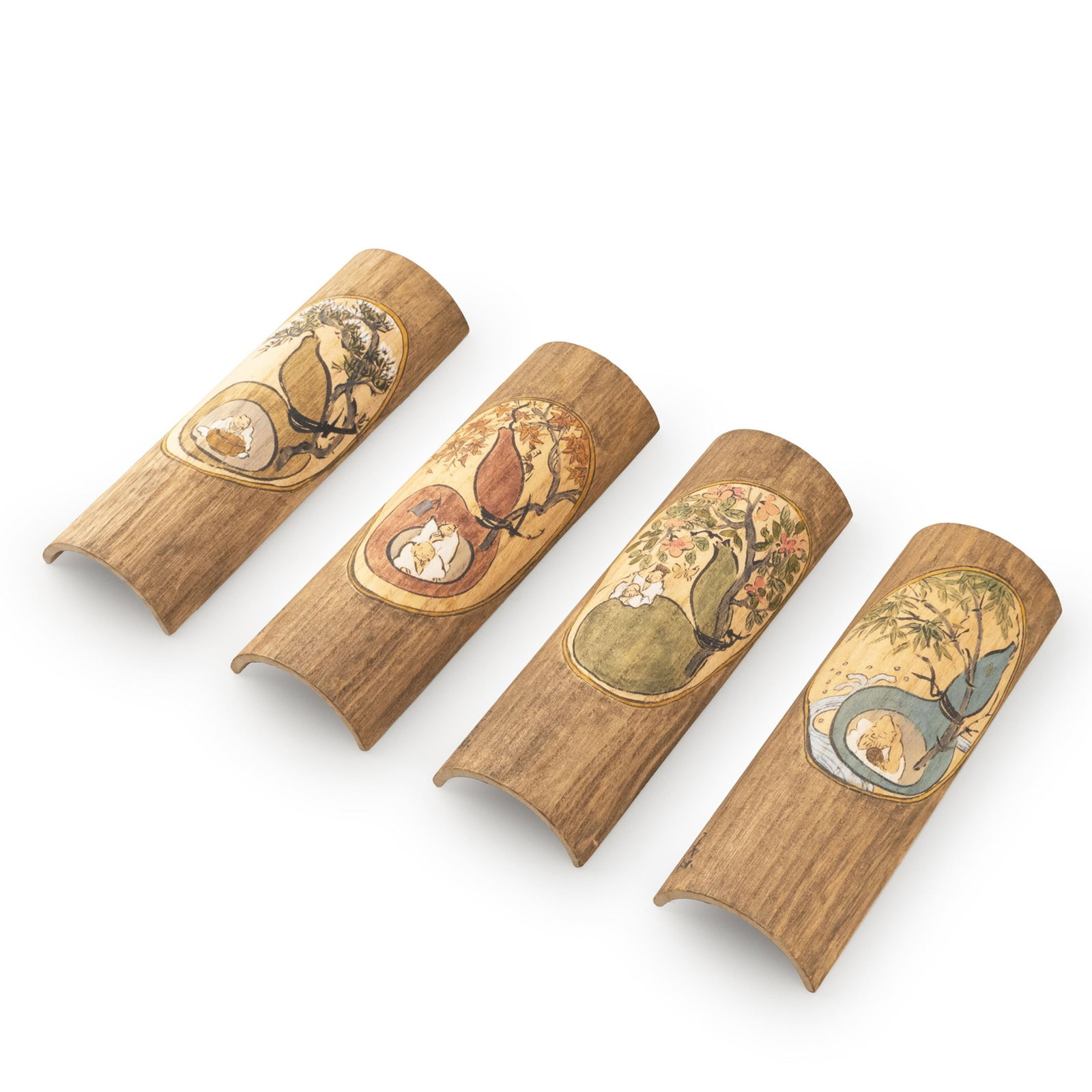 Four Tea Scoops, Tomobako: This refined set of four tea scoops is fashioned from paulownia wood, each carved with a gently curved profile that preserves the natural character of the material. Oval gourd-shaped reserves are deli