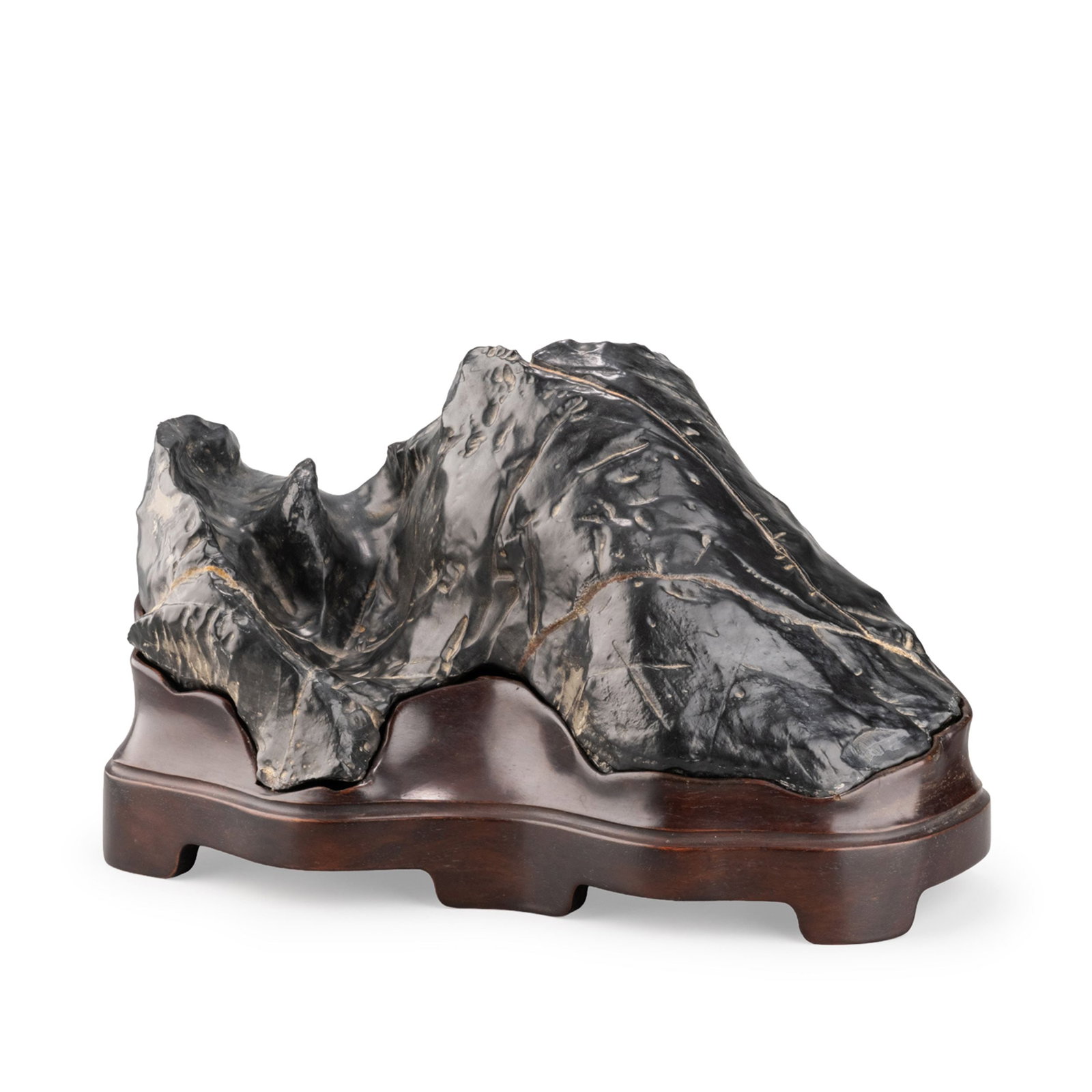 Lingbi Scholar's Rock: A naturally formed Lingbi scholar's rock distinguished by its dramatic mountain-like silhouette and lustrous black surface. The stone displays deeply weathered contours, undulating ridges, and natural