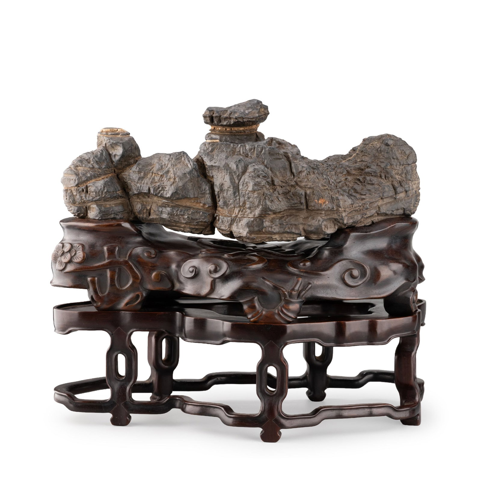 Stone Ornament: A naturally formed scholar's viewing stone of rugged horizontal composition, displaying layered striations, weathered textures, and dramatic fissures that evoke the grandeur of a mountain landscape. T