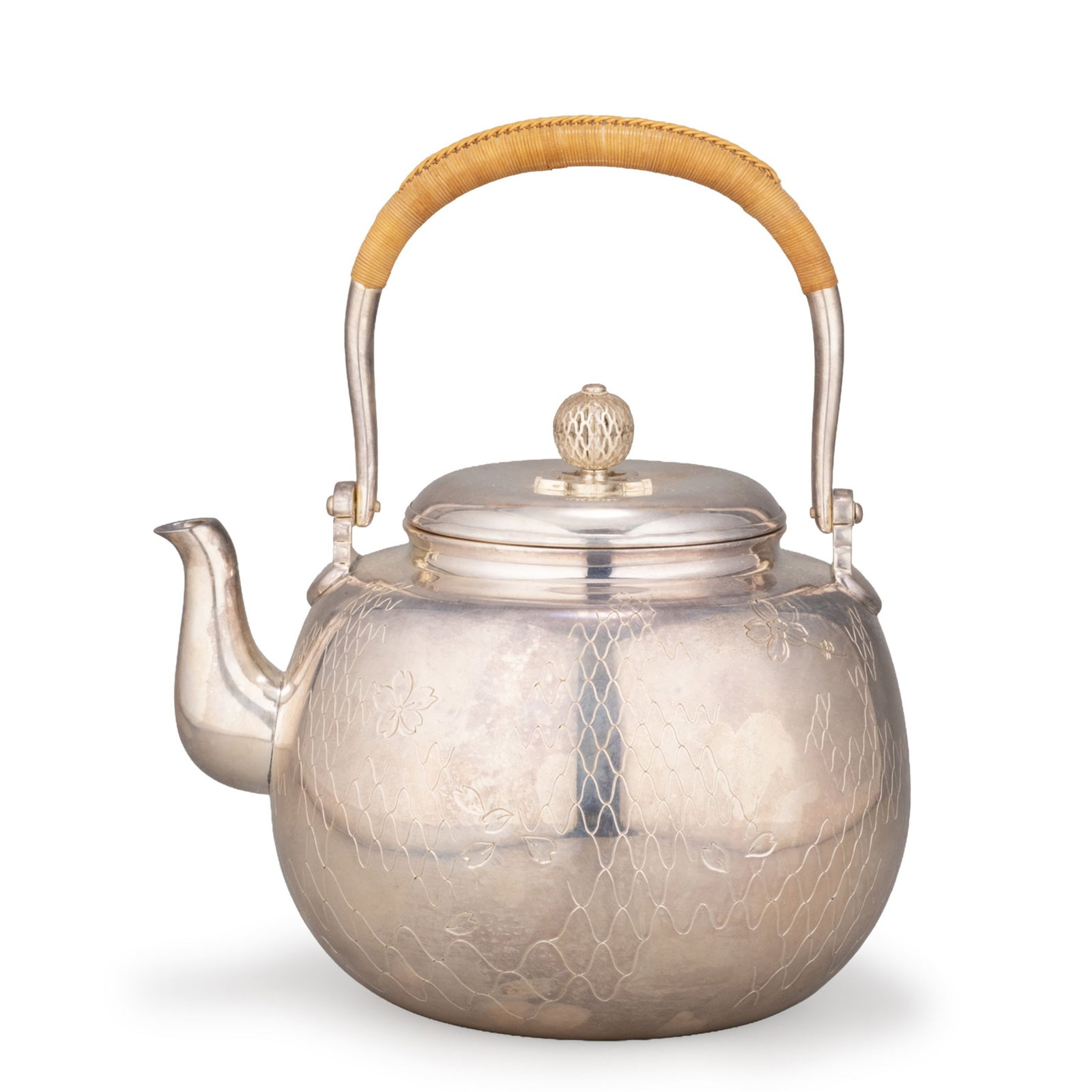 Tea Kettle by Hata Zoroku IV: Heir to the celebrated Kyoto metalworking lineage. Its graceful rounded form and softly polished silver surface exemplify the distinguished craftsmanship for which the Hata family has long been renown