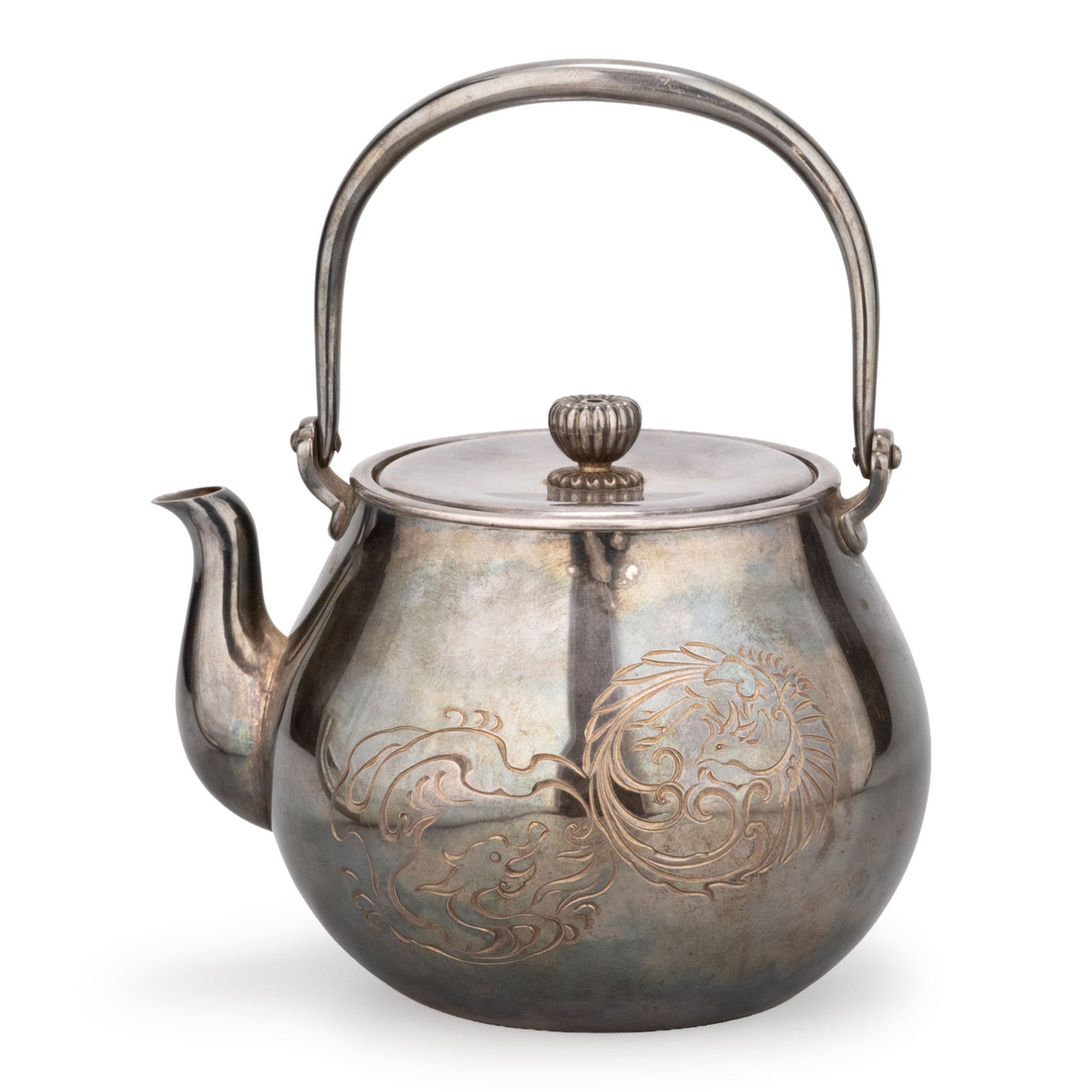 Pure Silver Kettle by Shugyokudo: This pure silver kettle is of elegant rounded form with a gracefully arched swing handle and a domed cover surmounted by a finely lobed knop. The balanced silhouette reflects the refined craftsmanship