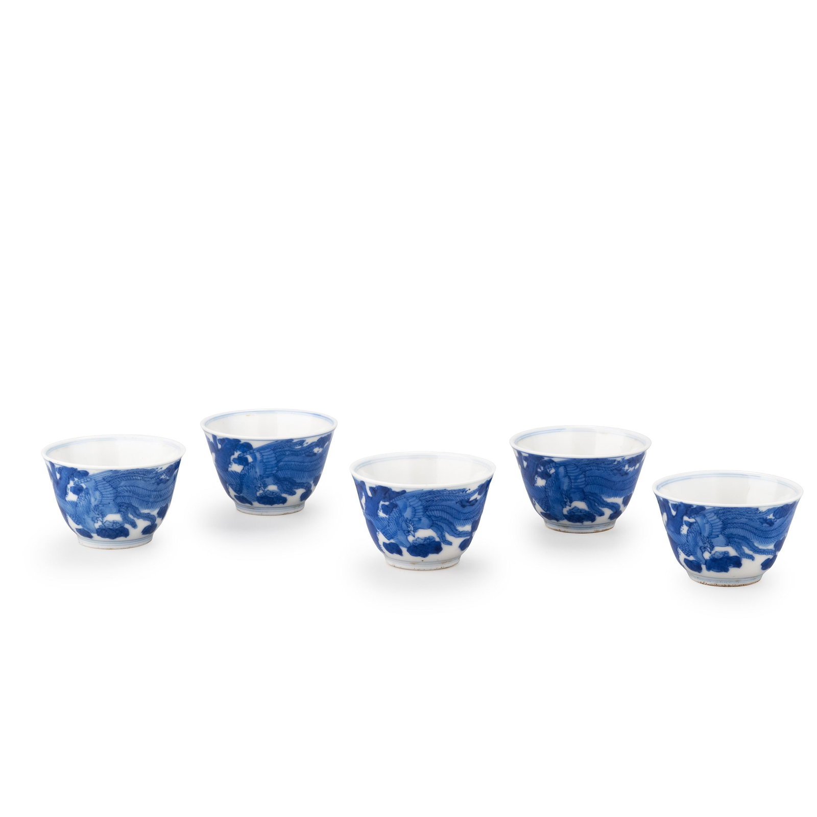 Set of Five Tea Bowls, Chenghua Mark: This elegant set of five blue and white porcelain tea bowls is decorated with the traditional phoenix and paulownia motif, inspired by the celebrated wares bearing the Chenghua reign mark. The gracefu