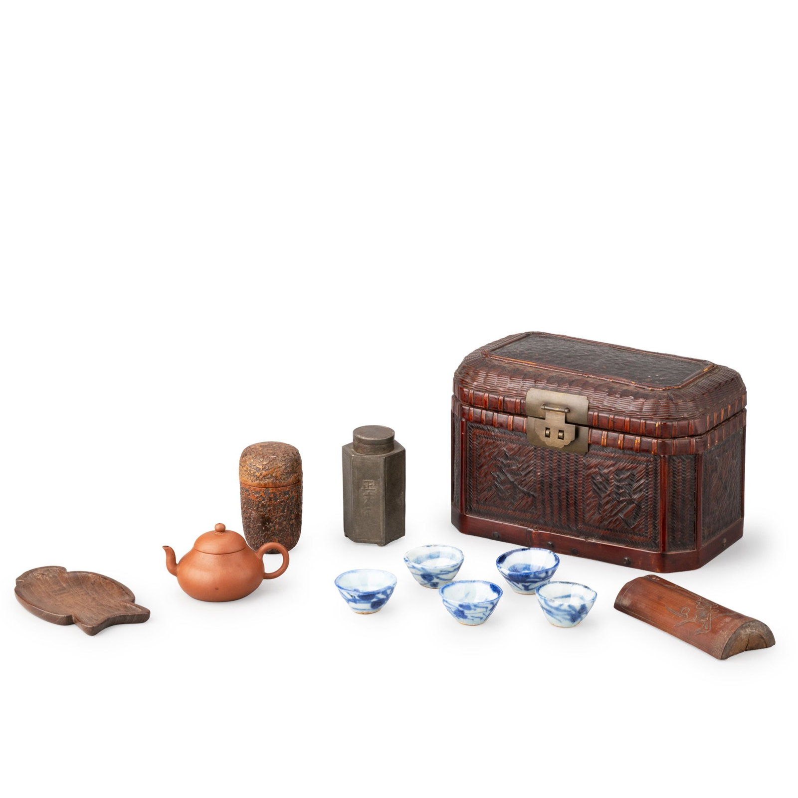 Tea Utensil Set: A complete tea utensil set comprising a red clay teapot, a red clay tea caddy, a pewter tea canister, five blue-and-white porcelain tea cups, a bamboo tea scoop, a wooden tea tray, and a finely woven 