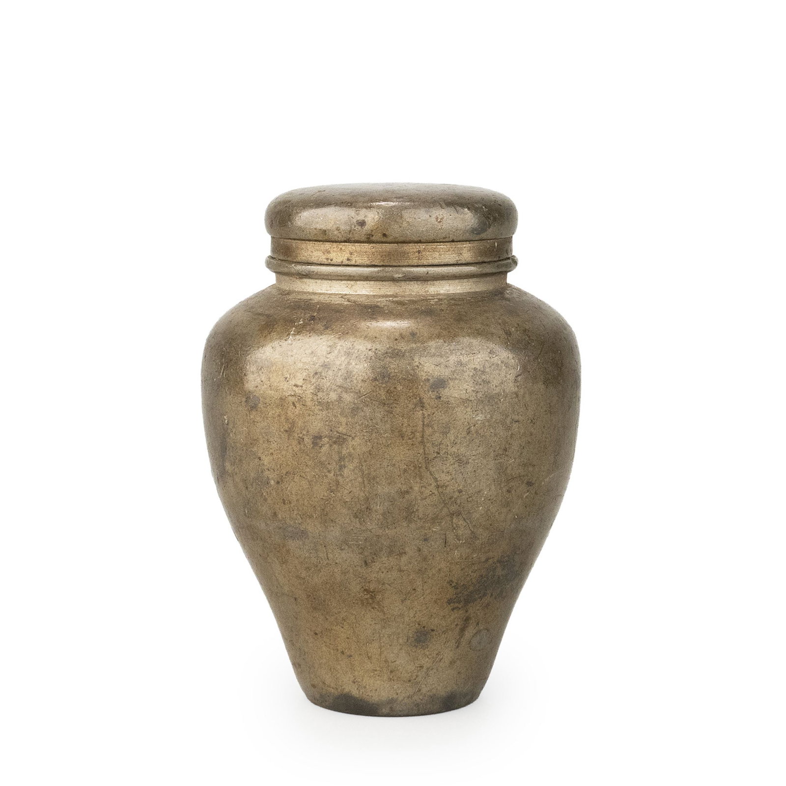 Antique tin tea caddy: A Chinese pewter tea caddy of elegant rounded form, featuring broad shoulders that taper gracefully toward a narrow foot. The restrained silhouette and balanced proportions reflect the refined simplic