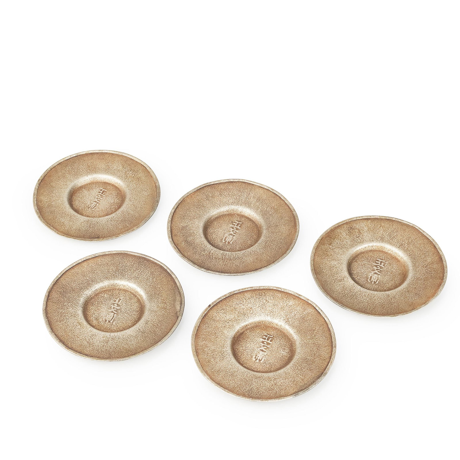 Tea Saucer by Seibunho: A refined set of five pewter tea saucers by Shobunpo [Shobunpo-zo], executed in a simple circular form that exemplifies the understated elegance of traditional tea wares. Each saucer features a gently