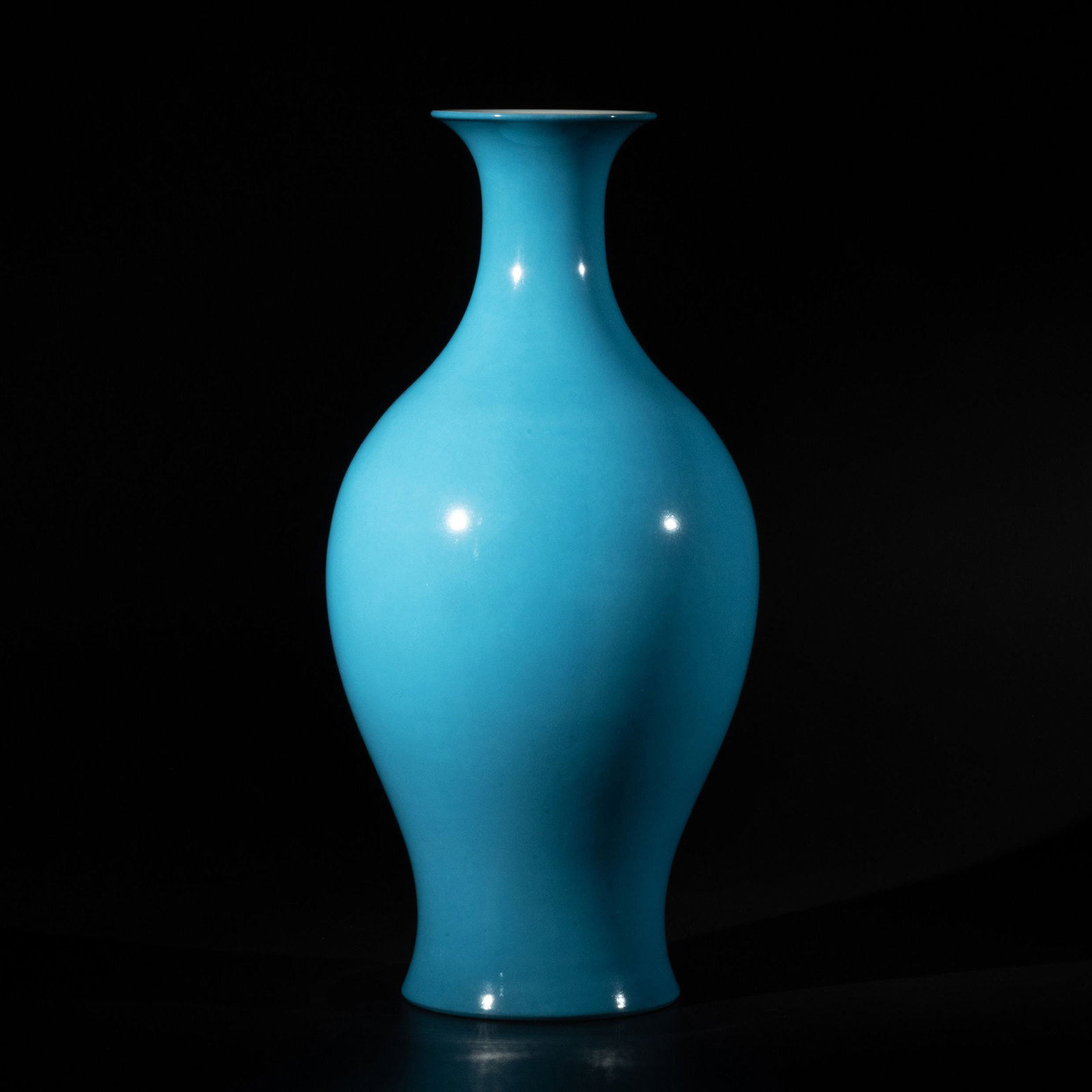 Blue-Glazed Vase by Cai Xiaofang: This elegant blue-glazed vase by Cai Xiaofang is distinguished by its refined baluster form, featuring a flared rim, slender neck, rounded shoulders, and gracefully tapering body, all executed in harm